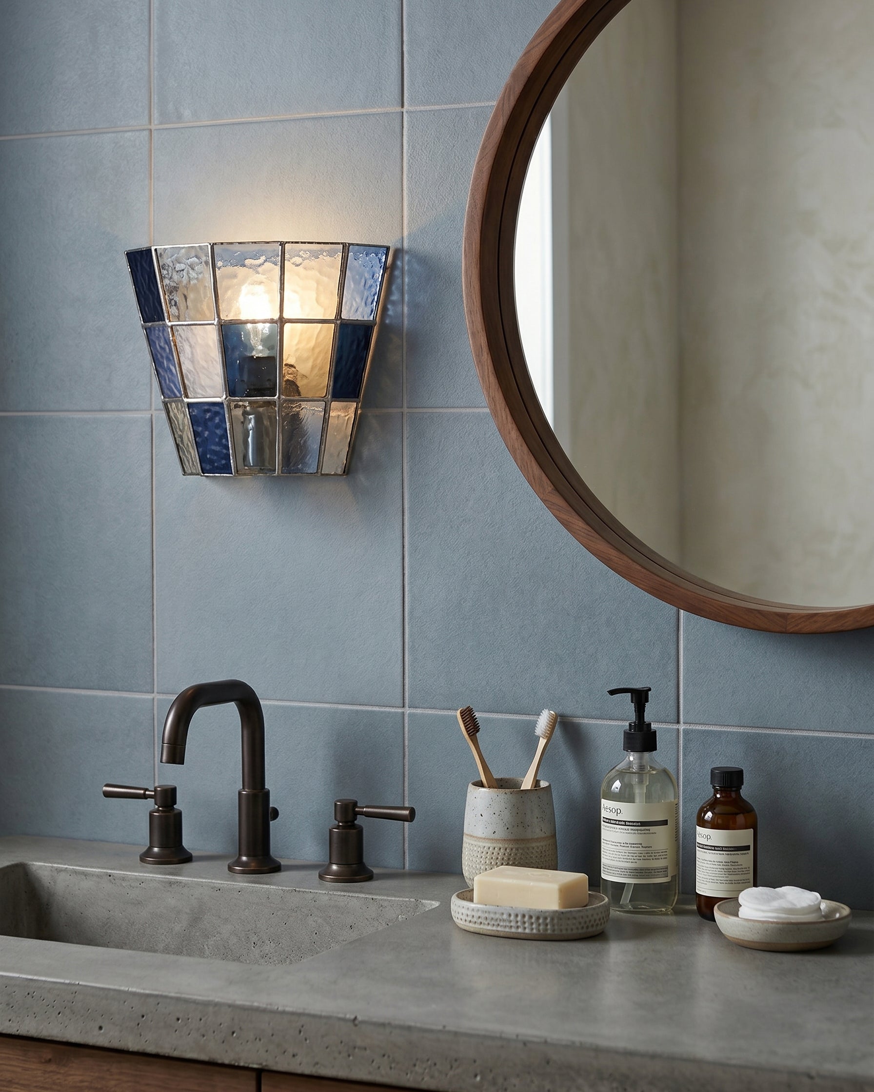 Angled view of the Zola Glass Sconce showing its geometric design.
