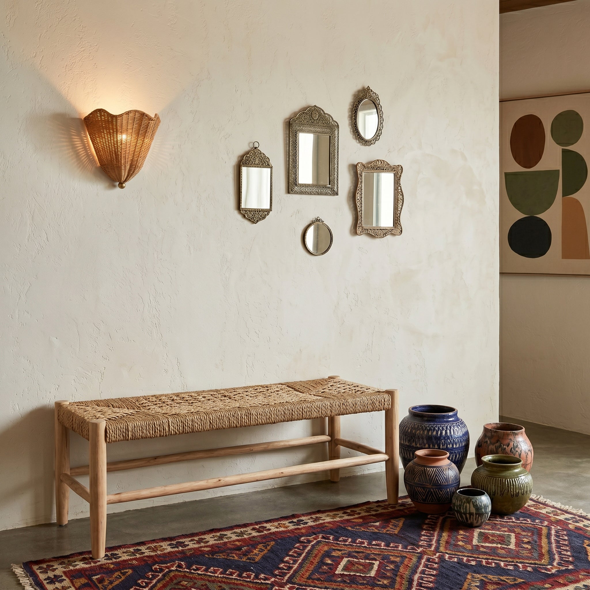 The wall sconce installed in a coastal-style hallway.