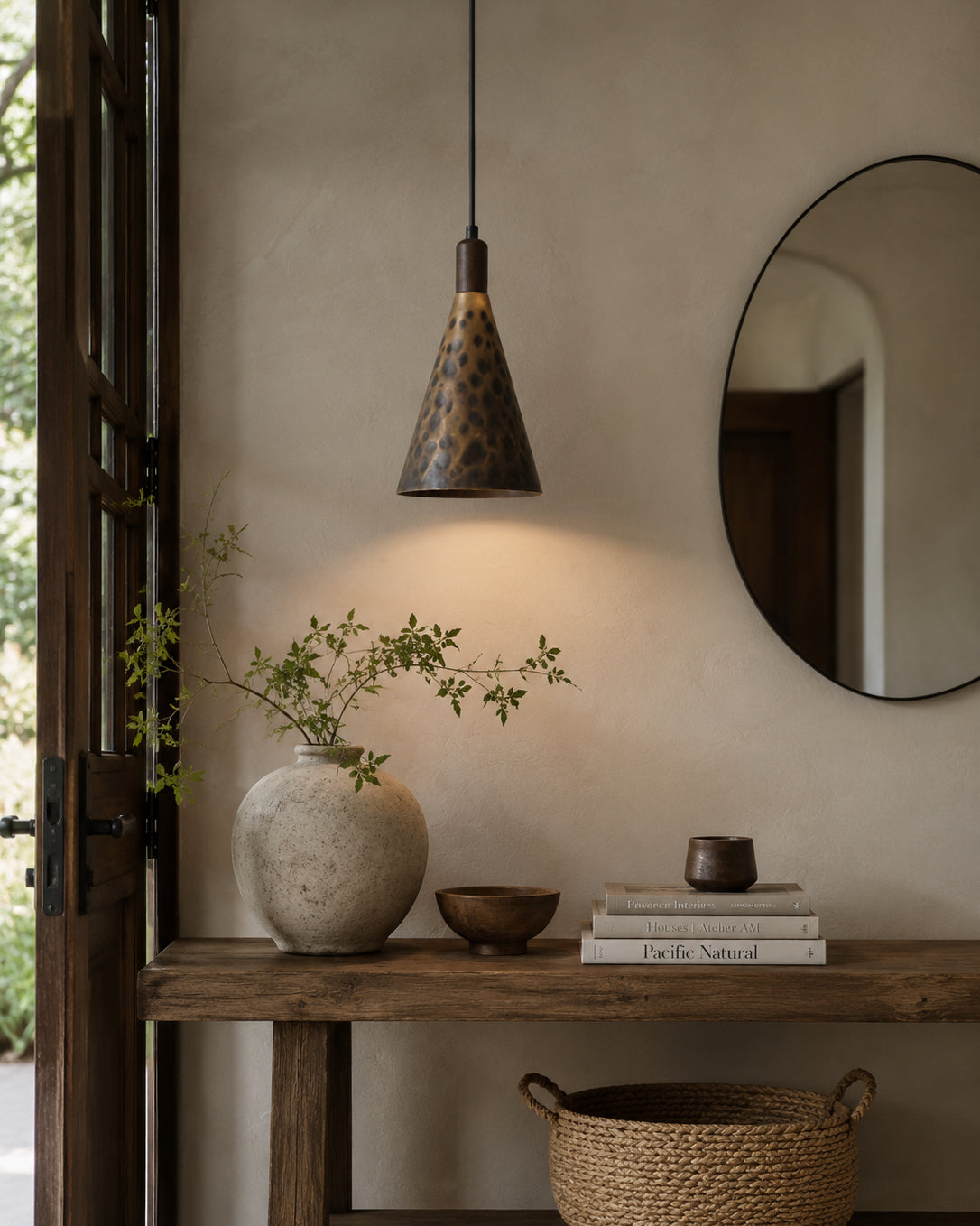 The Boyd Pendant Lamp illuminated, casting a warm, focused downward light.