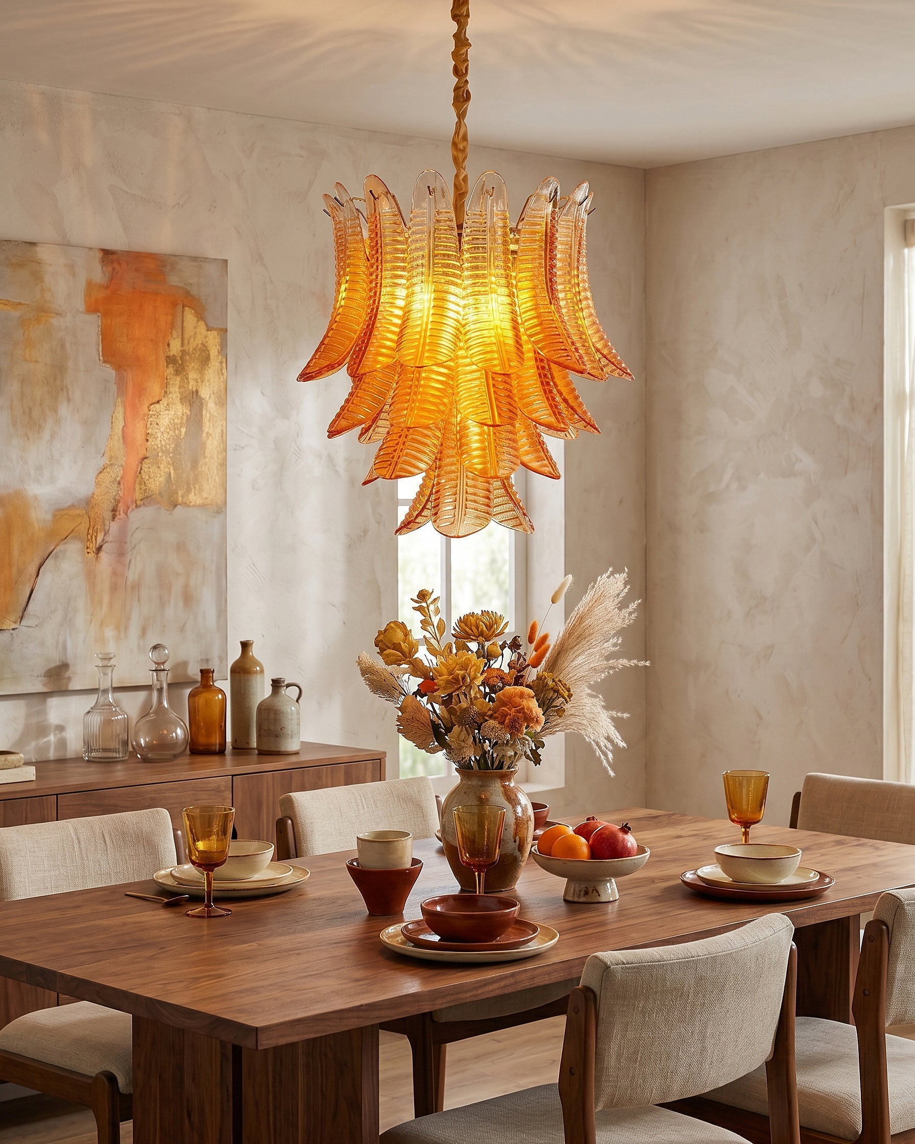 The luxurious gold-finished metal details of the Isolde Glass Chandelier.