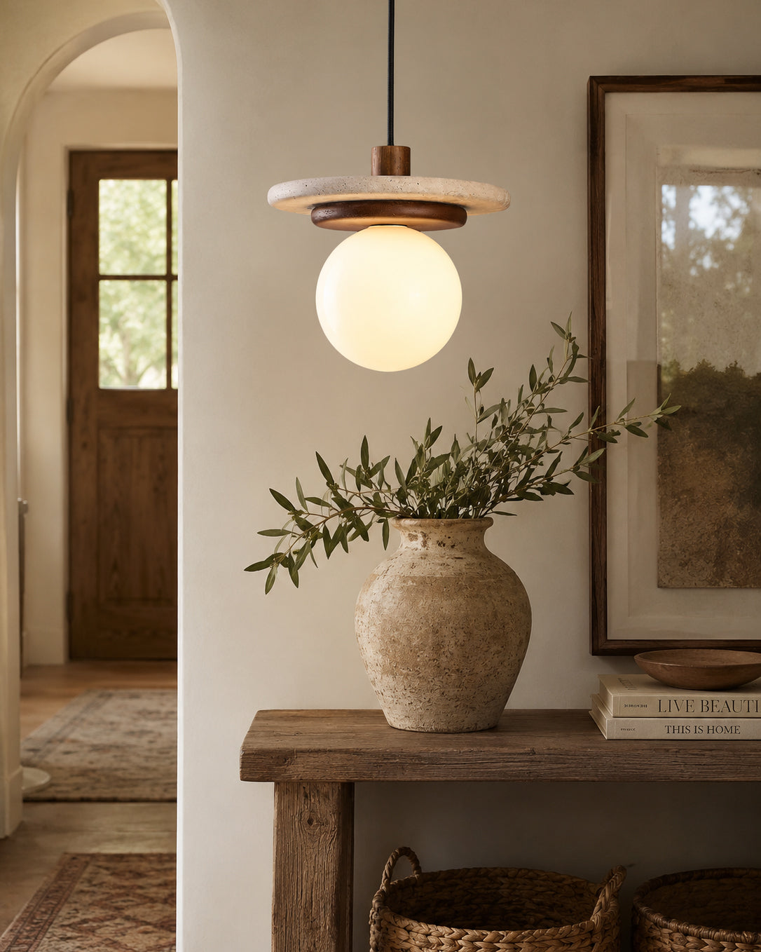 The 3-light linear canopy version of the Farren pendant light shown in a dining room setting.