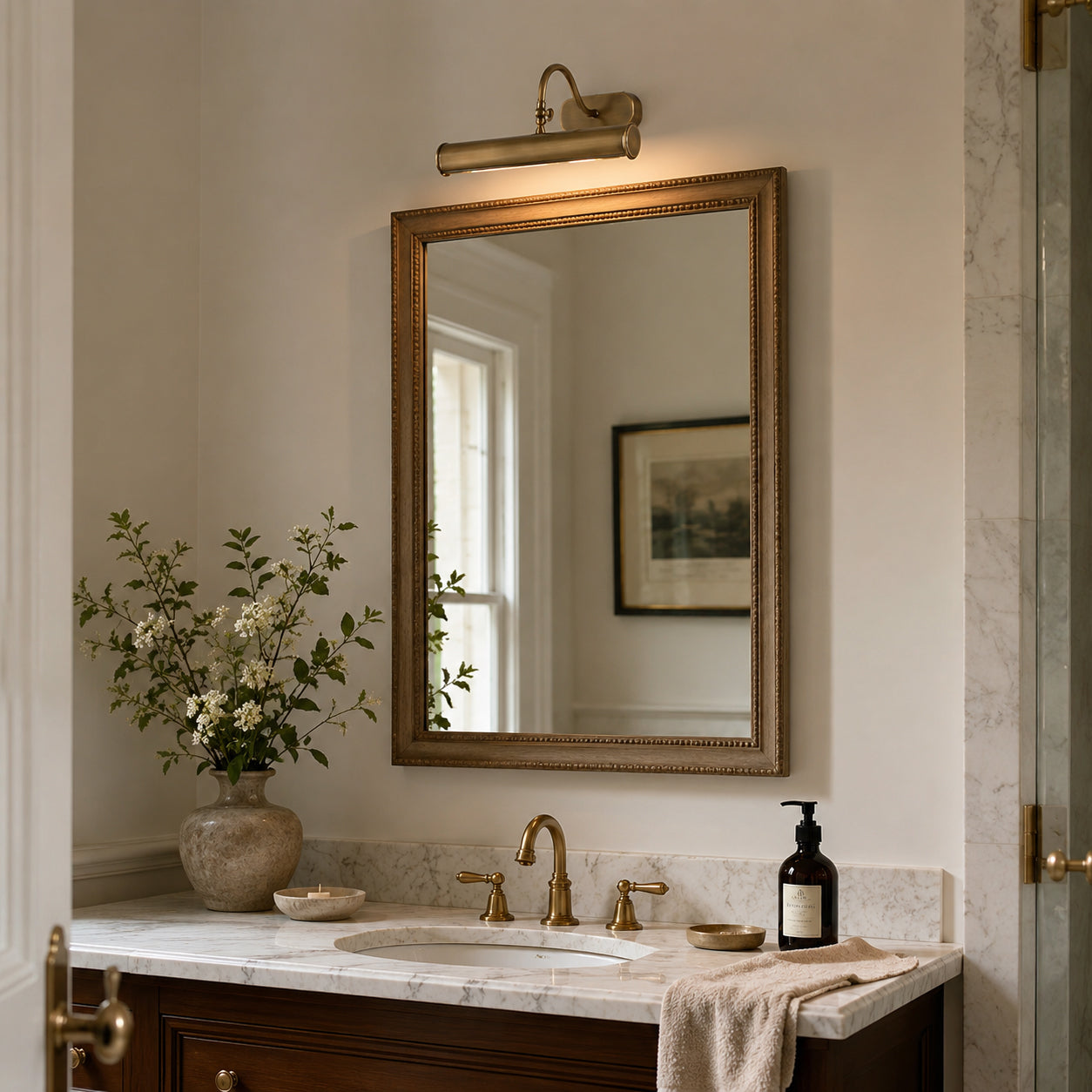 Detail shot of the clean-lined end cap of the Ainsworth Brass Wall Sconce.