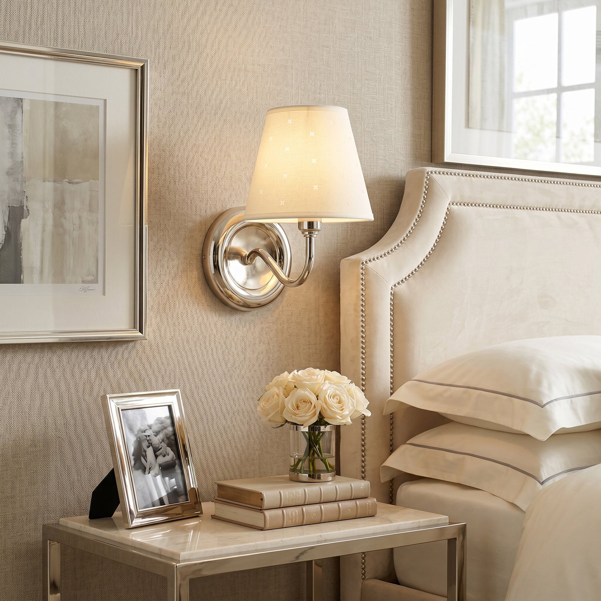 Close-up of the linen shade on the Caleb sconce, showing the starburst perforation details.