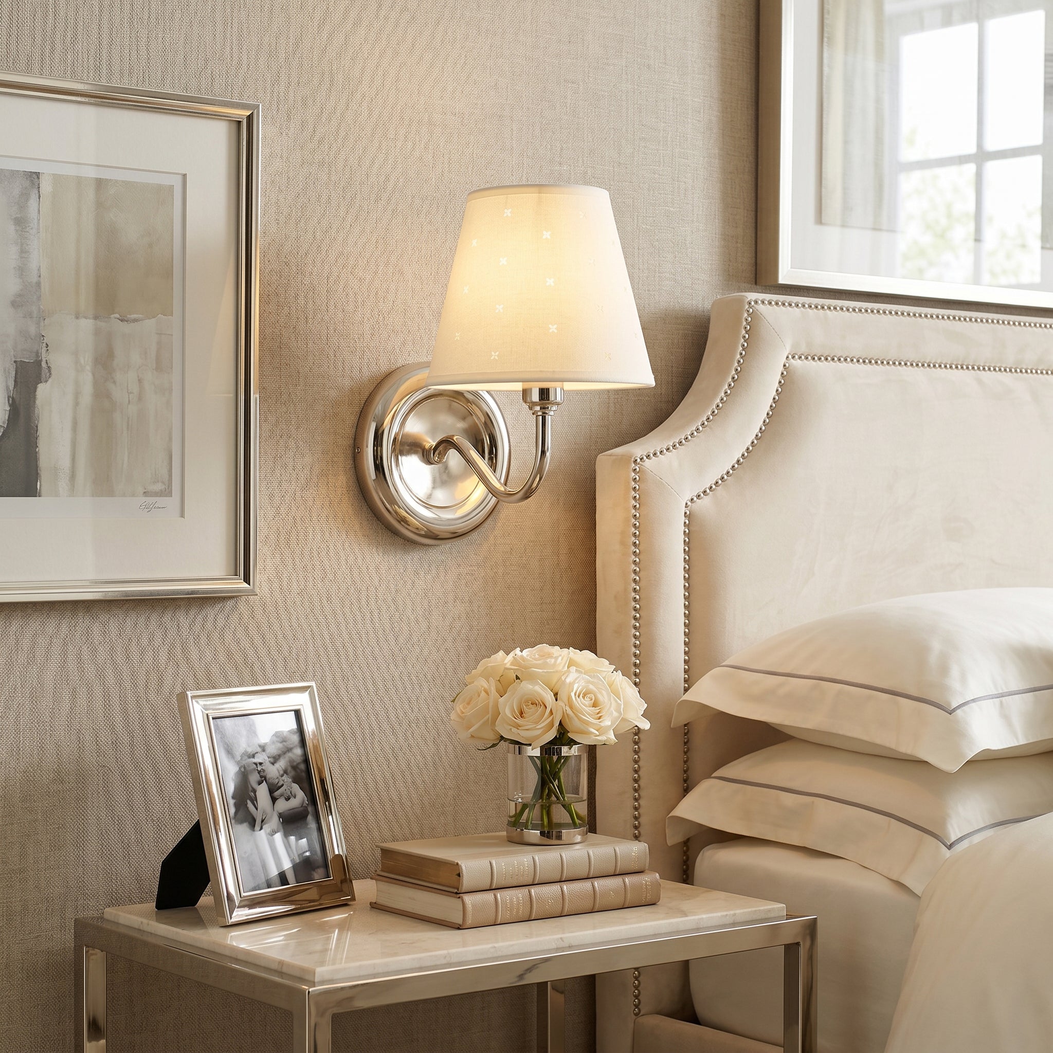 Close-up of the linen shade on the Caleb sconce, showing the starburst perforation details.