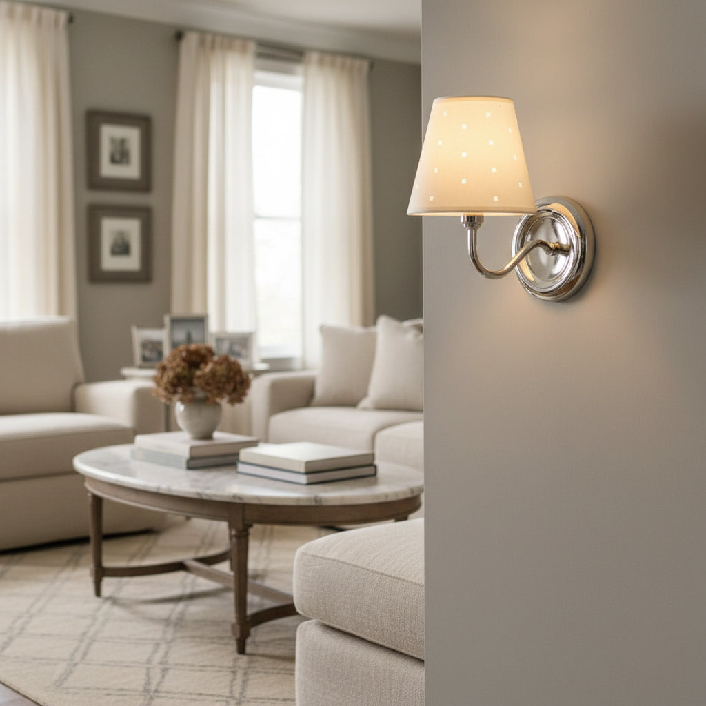 Angled view of the white and chrome Caleb Starburst Wall Sconce.