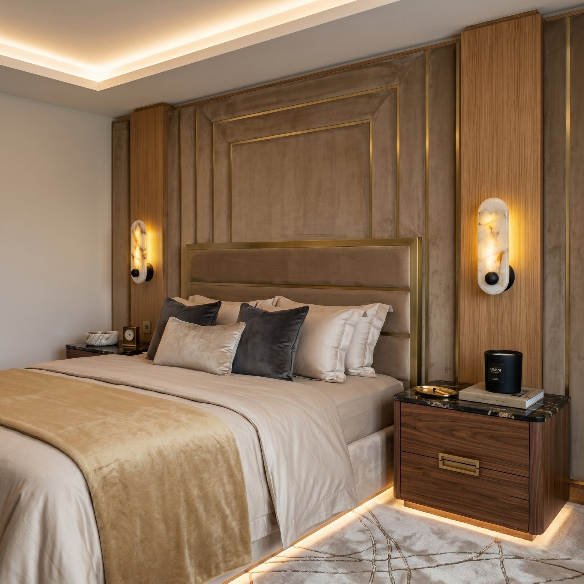 The Breuer Alabaster Wall Sconce with an antique bronze finish, adding a touch of warmth.