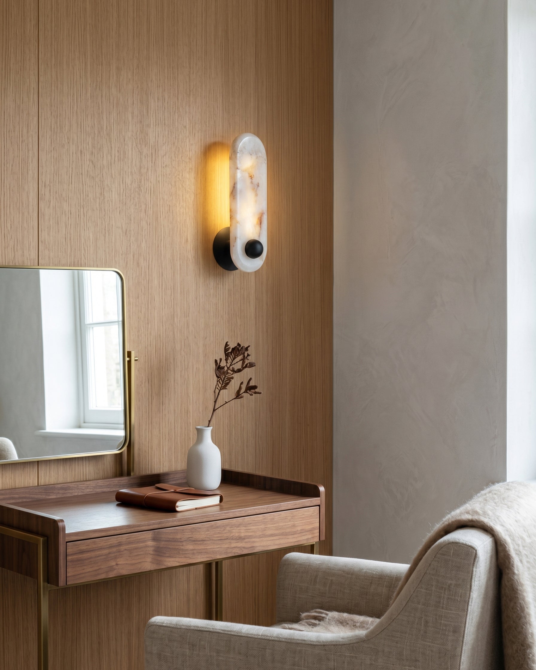 The Breuer Alabaster Wall Sconce with a white finish for a clean, monochromatic look.