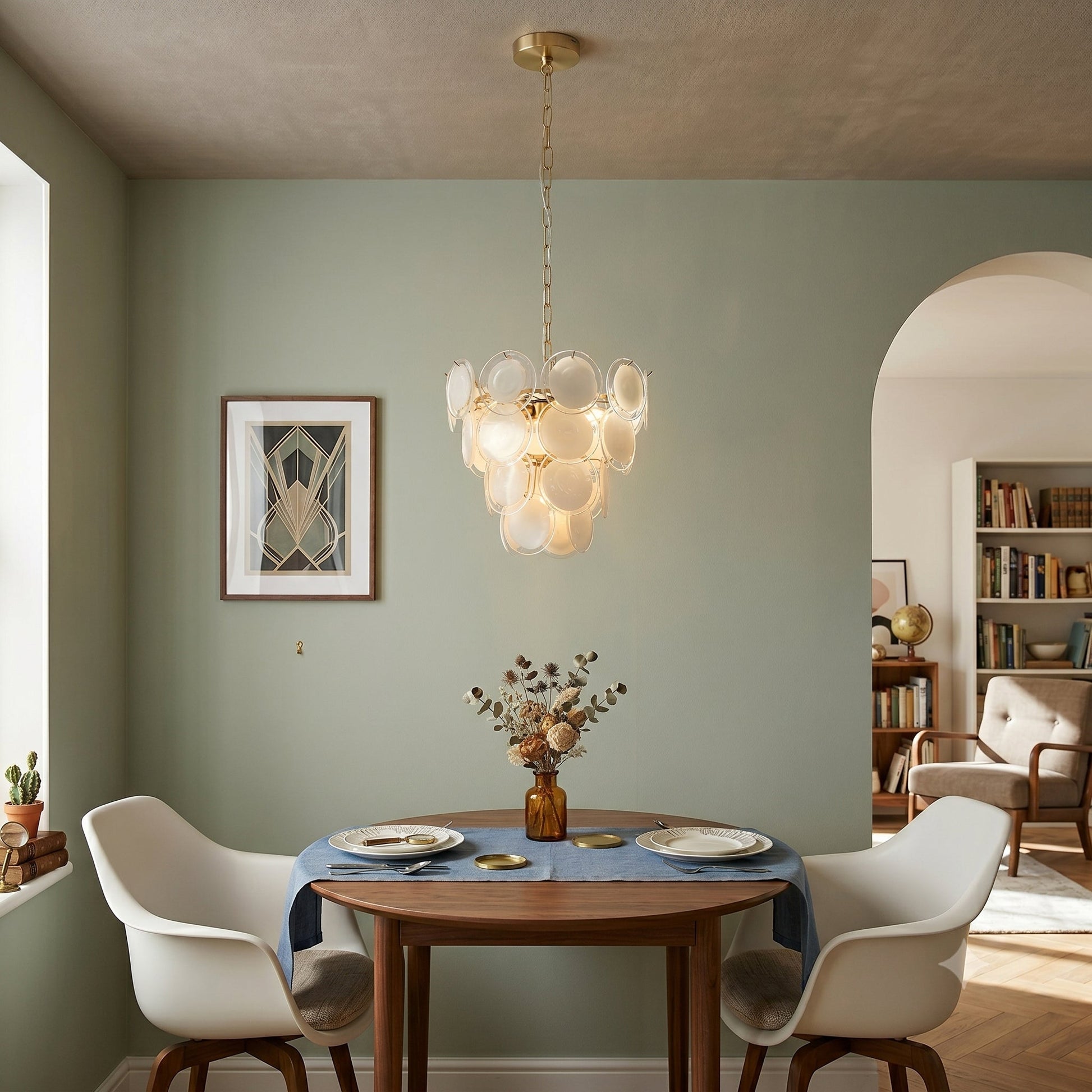 The pendant light in a dining room setting over a table.