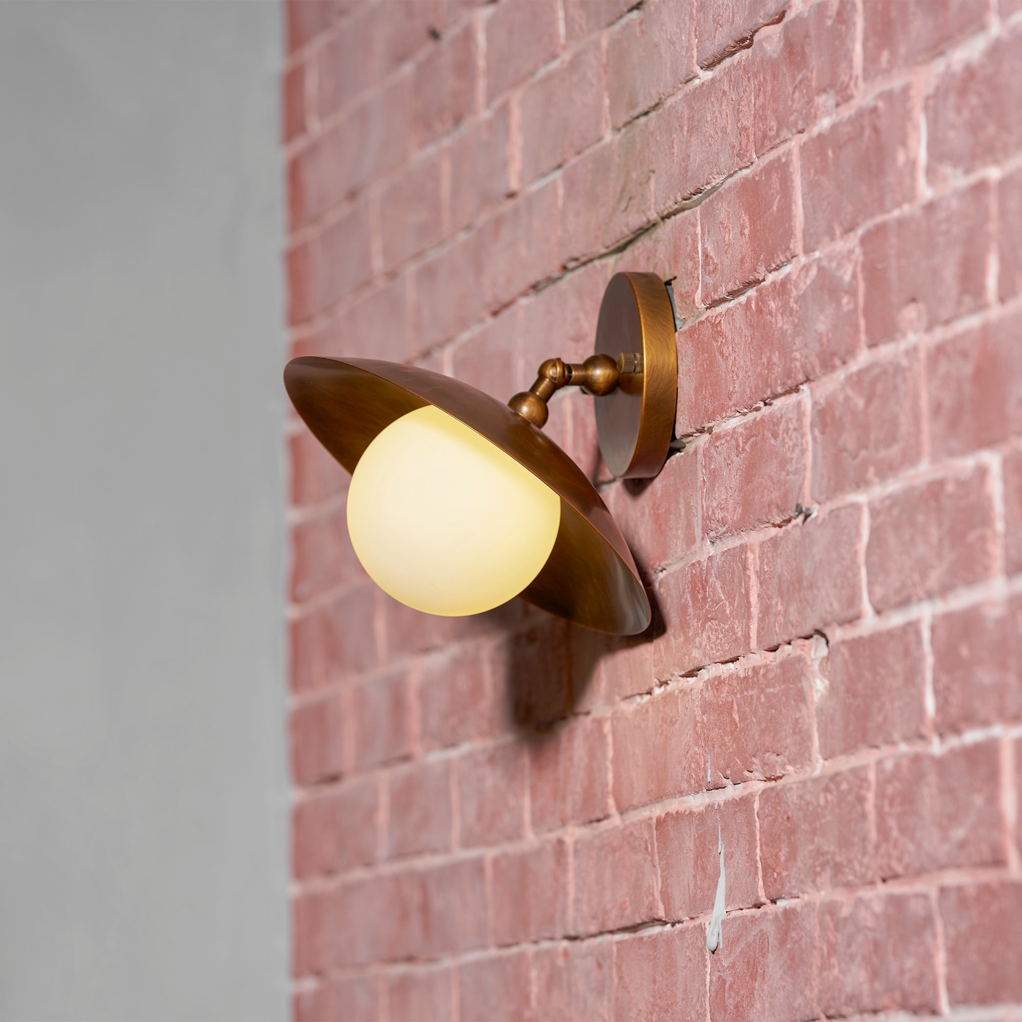 Three-quarter view of the Marie Petite lamp with black finish and opal glass.