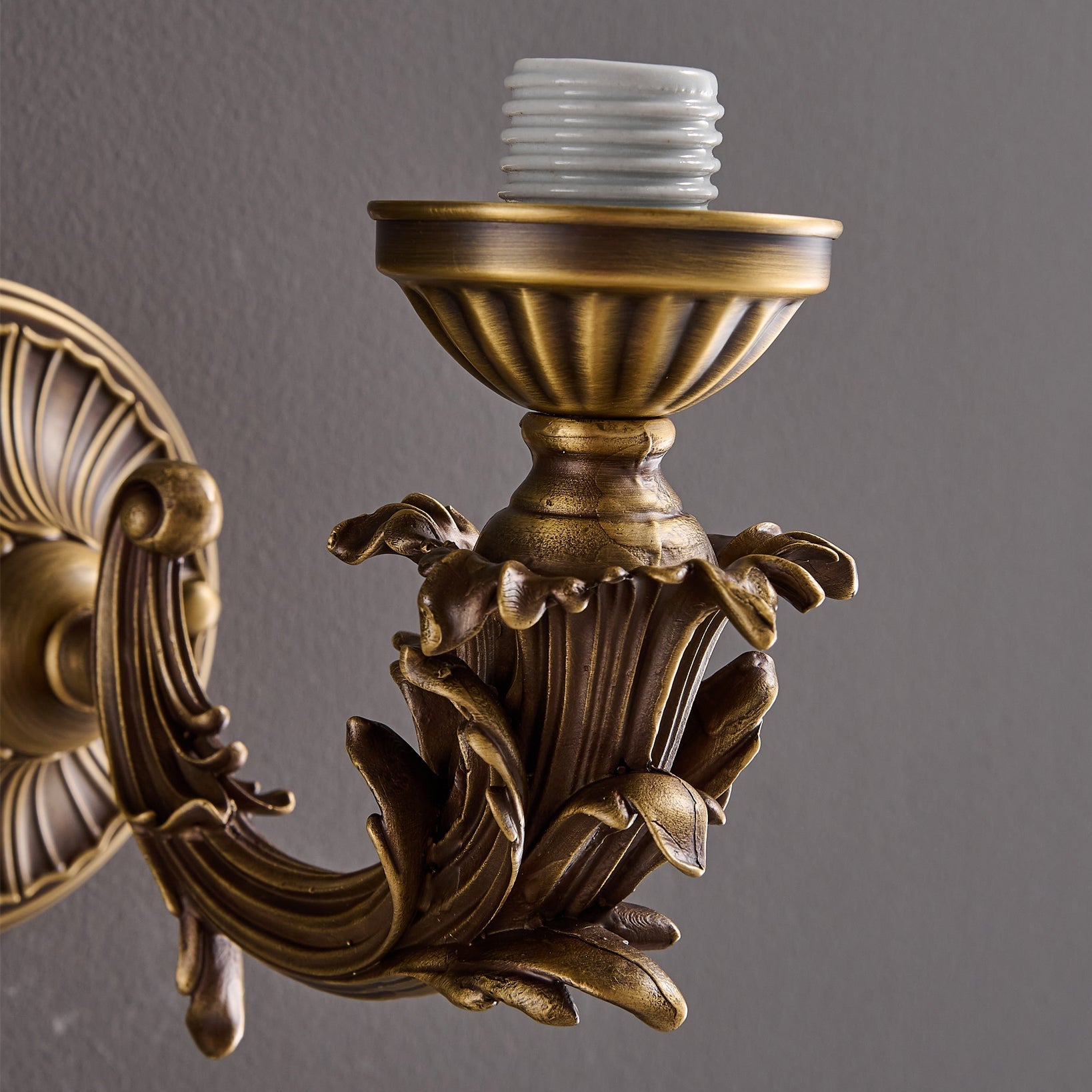 The lamp shown as a pair on either side of a mirror.