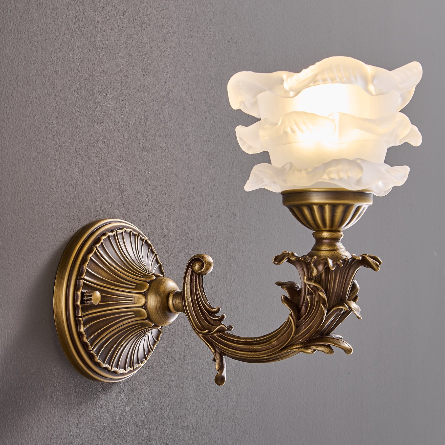 Product shot showing the texture of the brass and glass materials.