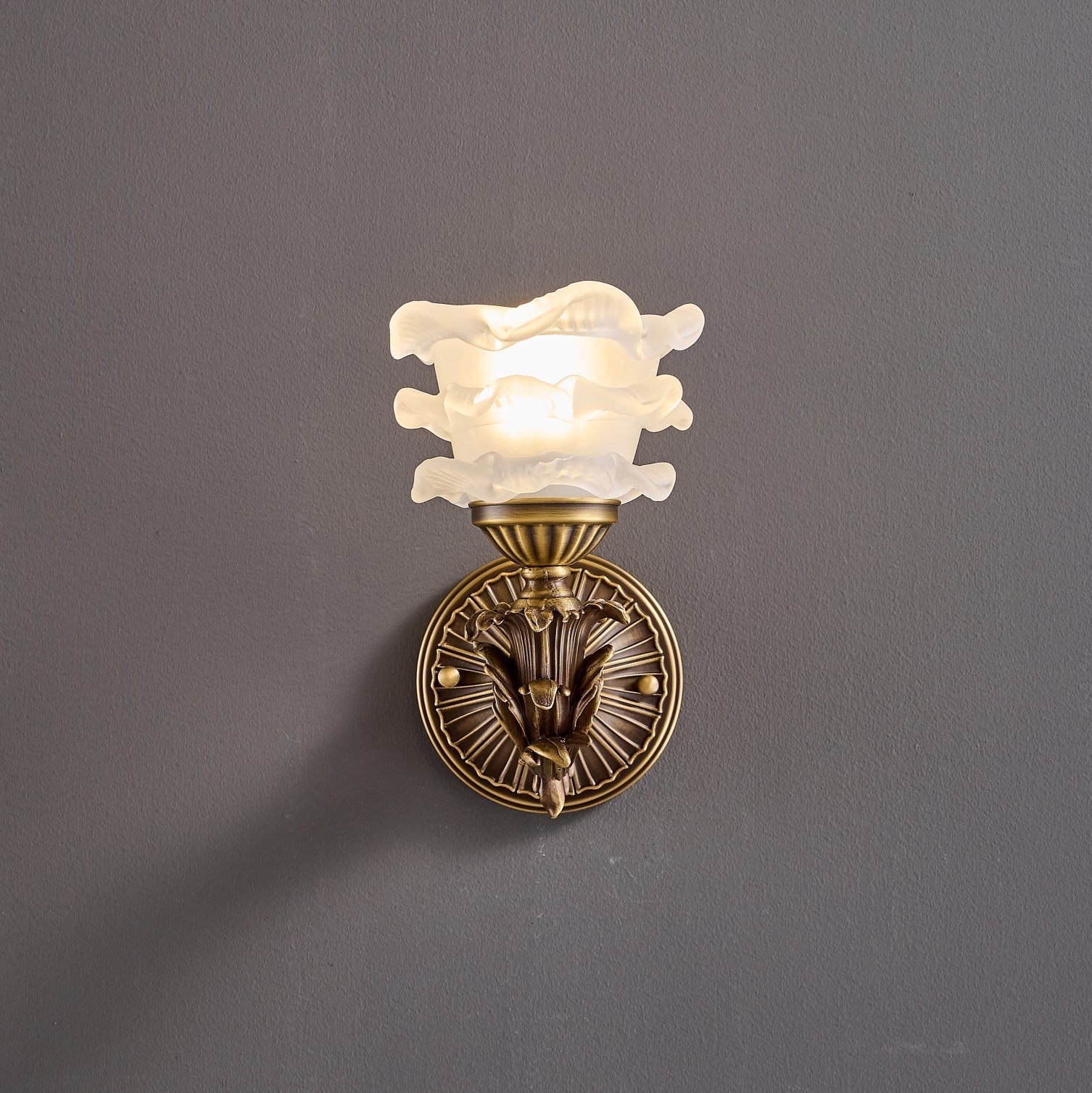 View of the lamp from a low angle, highlighting the glass shade.