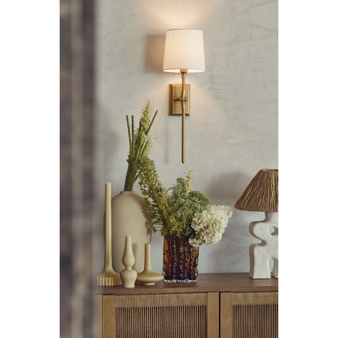 Dauphine Wall Sconce used as a bedside light in a transitional bedroom.