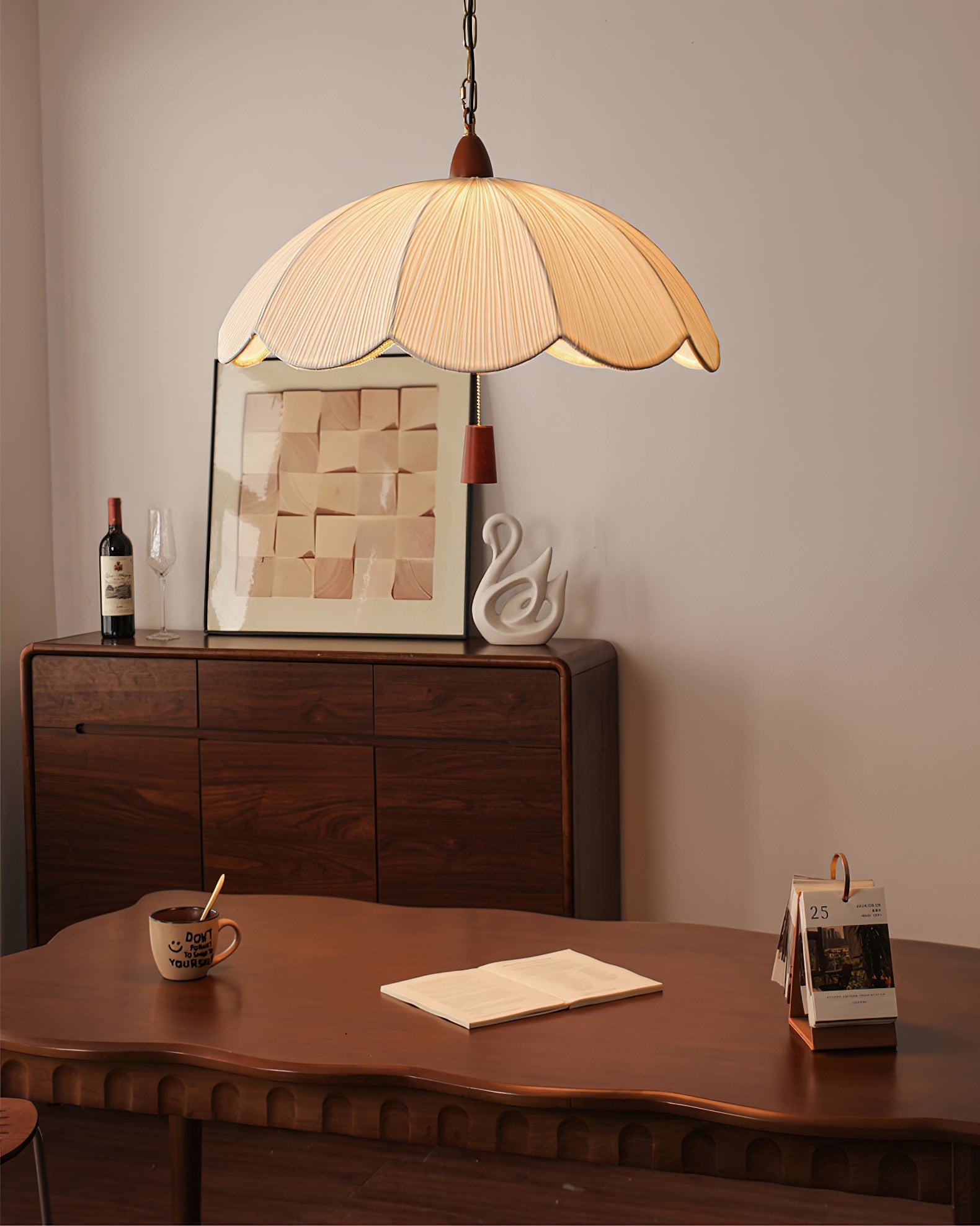 Dawson Pendant Light hanging over a modern dining table.