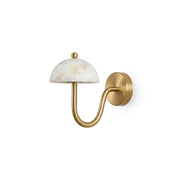 Ripple Alabaster Wall Sconce with brass arm against a neutral wall.