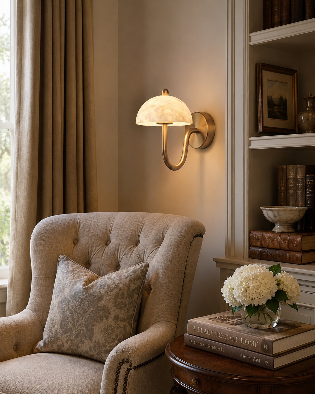 Lifestyle view of the Ripple Alabaster Wall Sconce in an elegant entryway.
