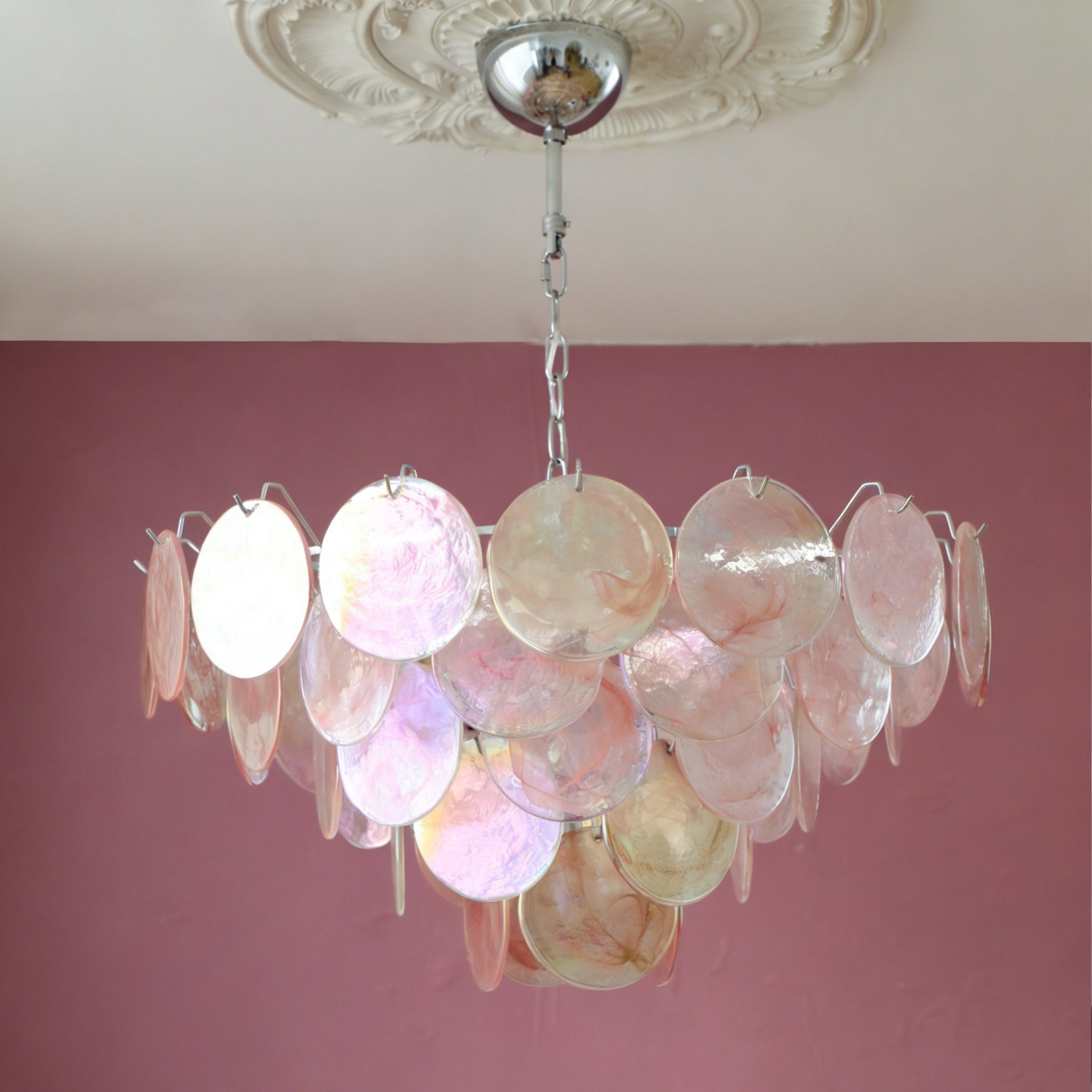 Close-up of the iridescent glass disks on the Brette chandelier.