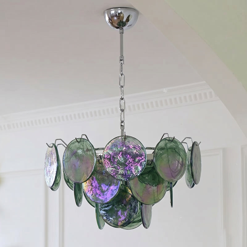 The Brette chandelier illuminated with warm temperature bulbs.