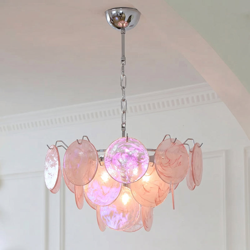 The Brette chandelier illuminated with cool temperature bulbs.