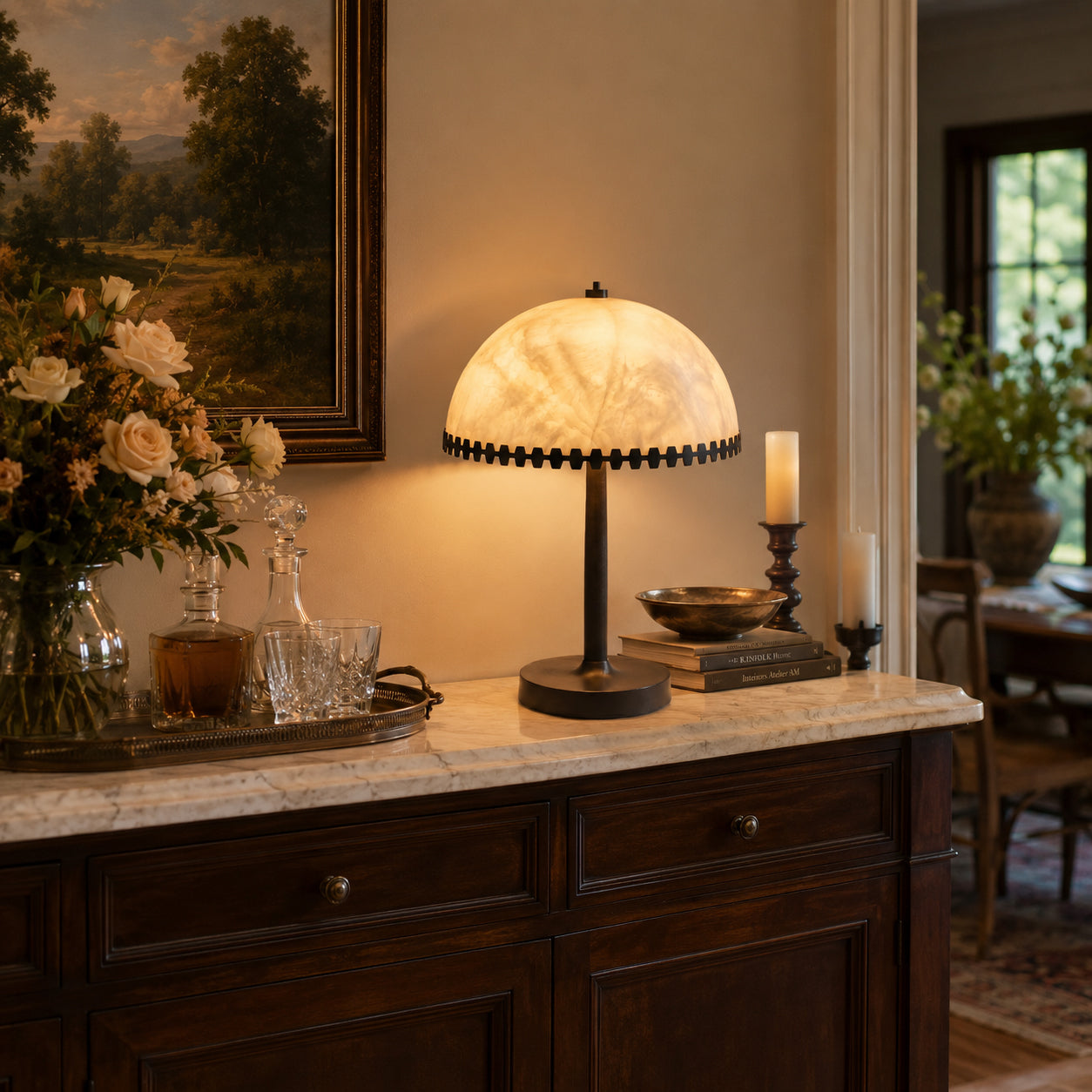 Bronson Alabaster Table Lamp styled on a living room end table.