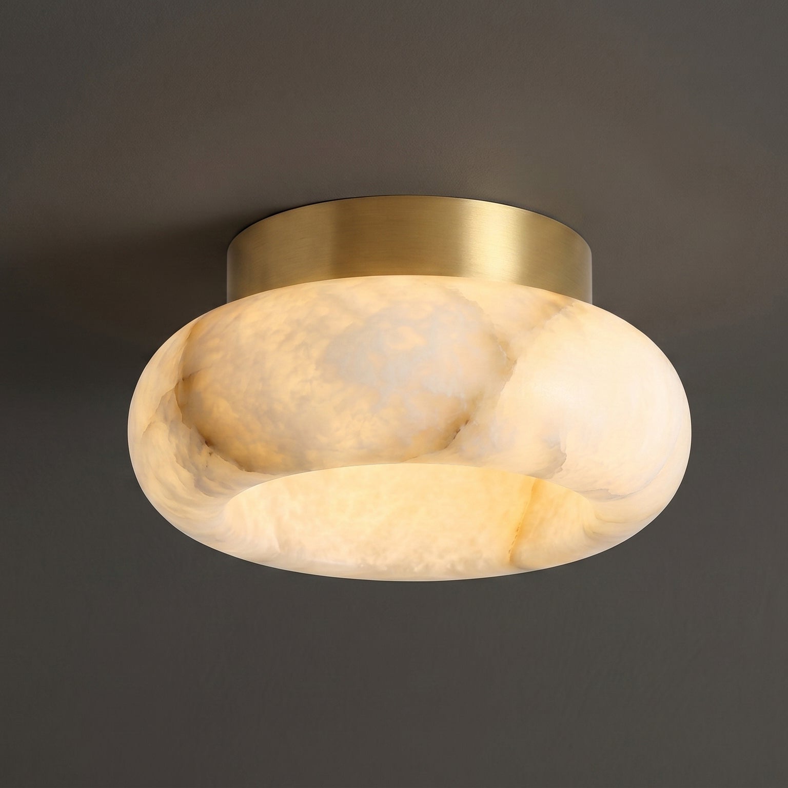 The white and brass finish of the Cairns Alabaster Ceiling Lamp.