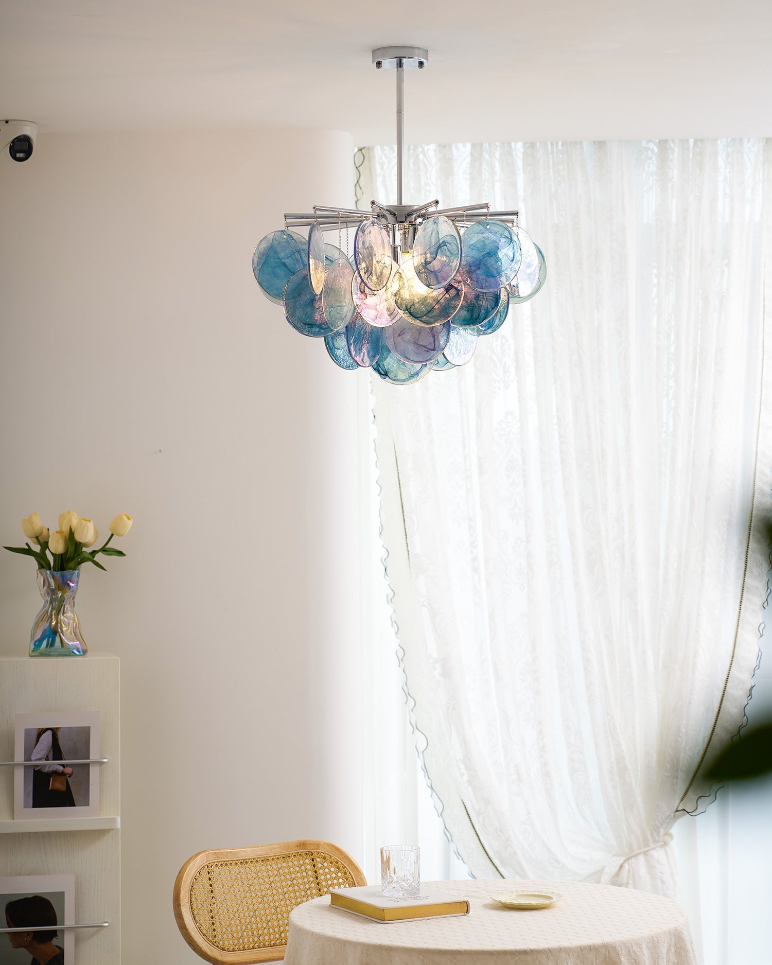 The chandelier shown with contemporary furniture.