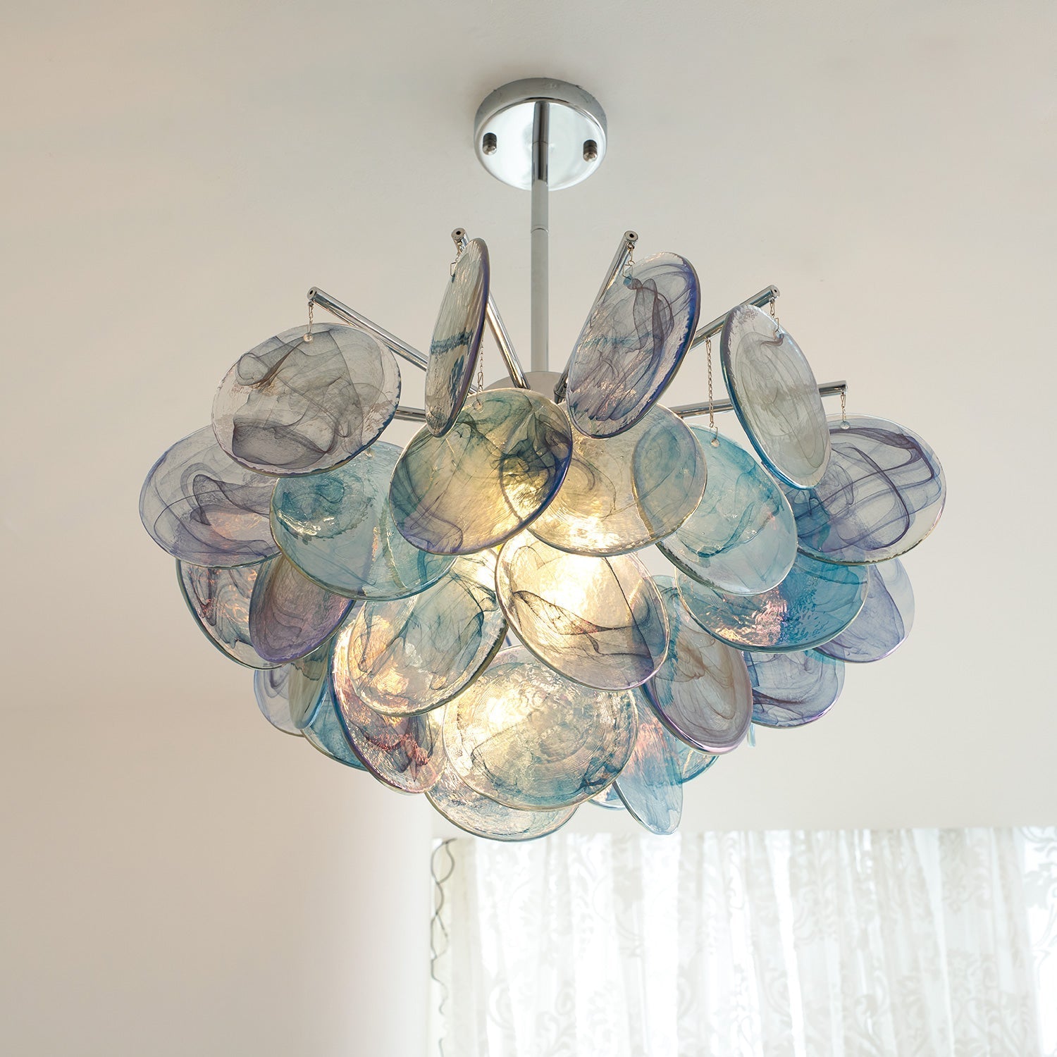 The Camisa Glass Chandelier creating an ambient glow.