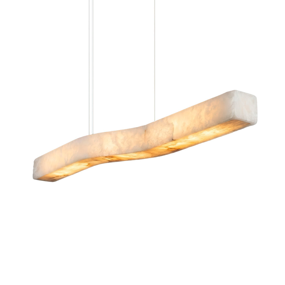 Camur Linear Alabaster Chandelier hanging over a modern dining table.
