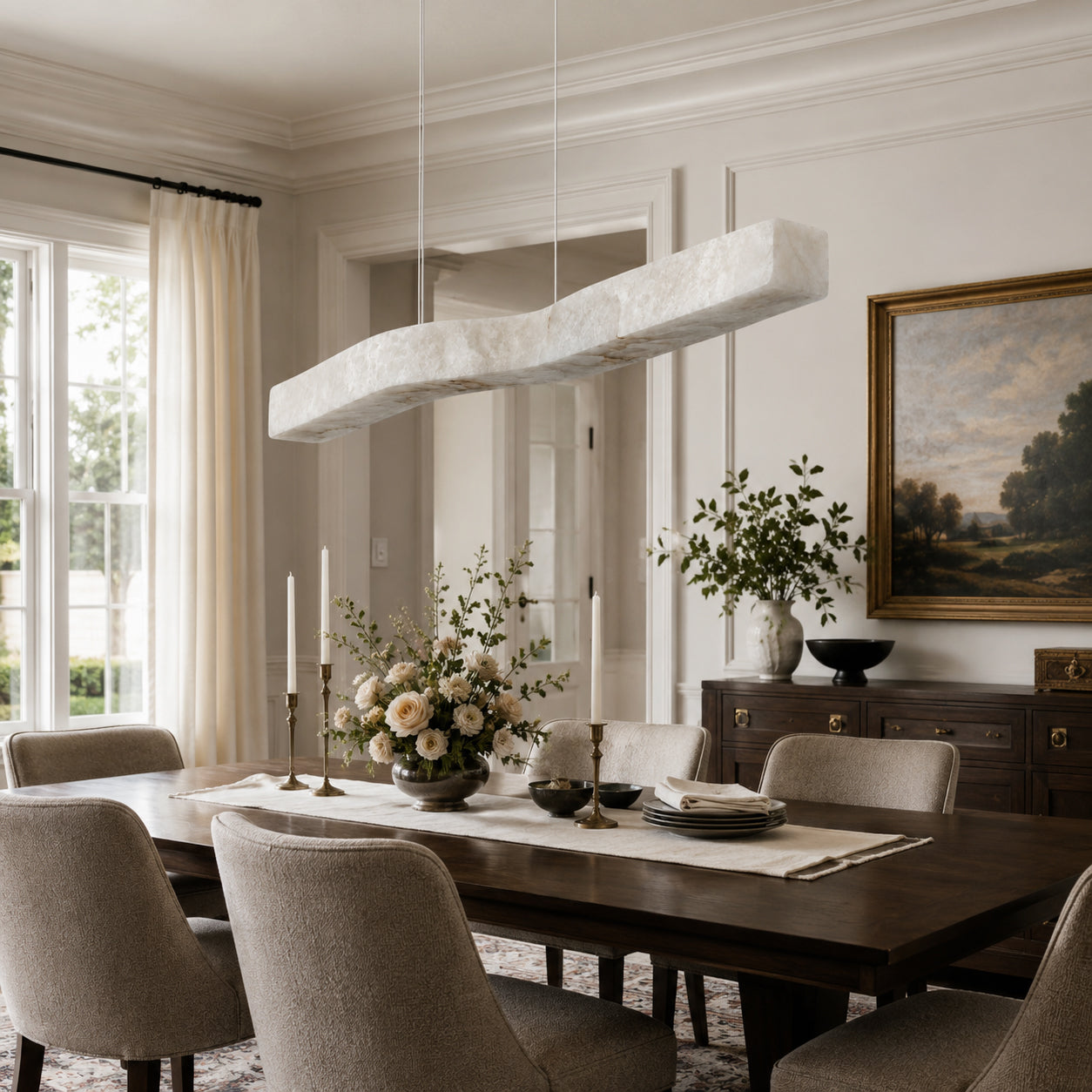 The linear chandelier shown in a minimalist kitchen island setting.