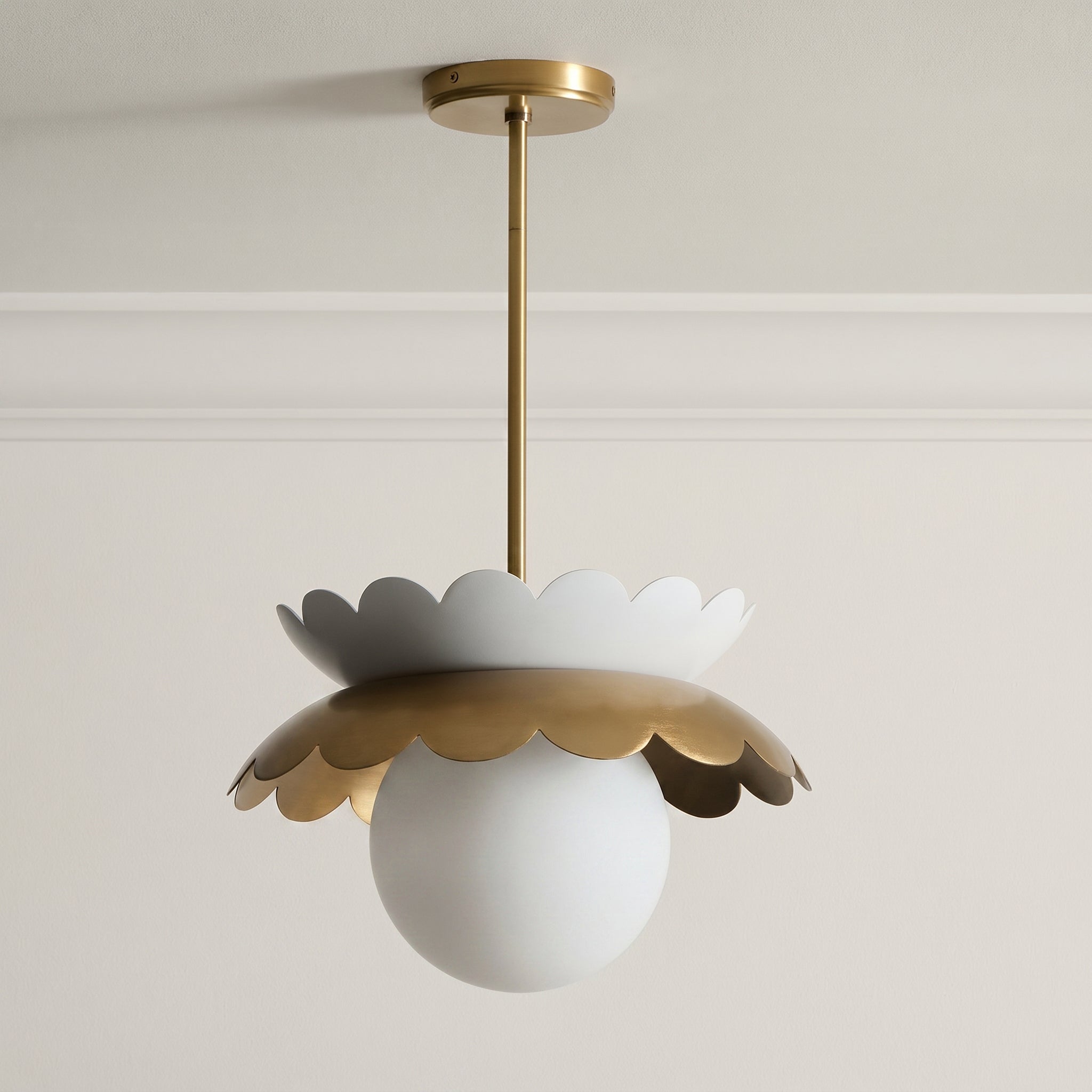 Capri Globe Pendant Light displayed against a dark background to emphasize its form.