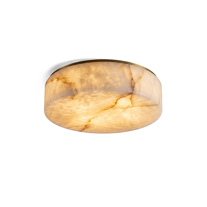 Close-up of the brass base of the Carrara alabaster ceiling light.