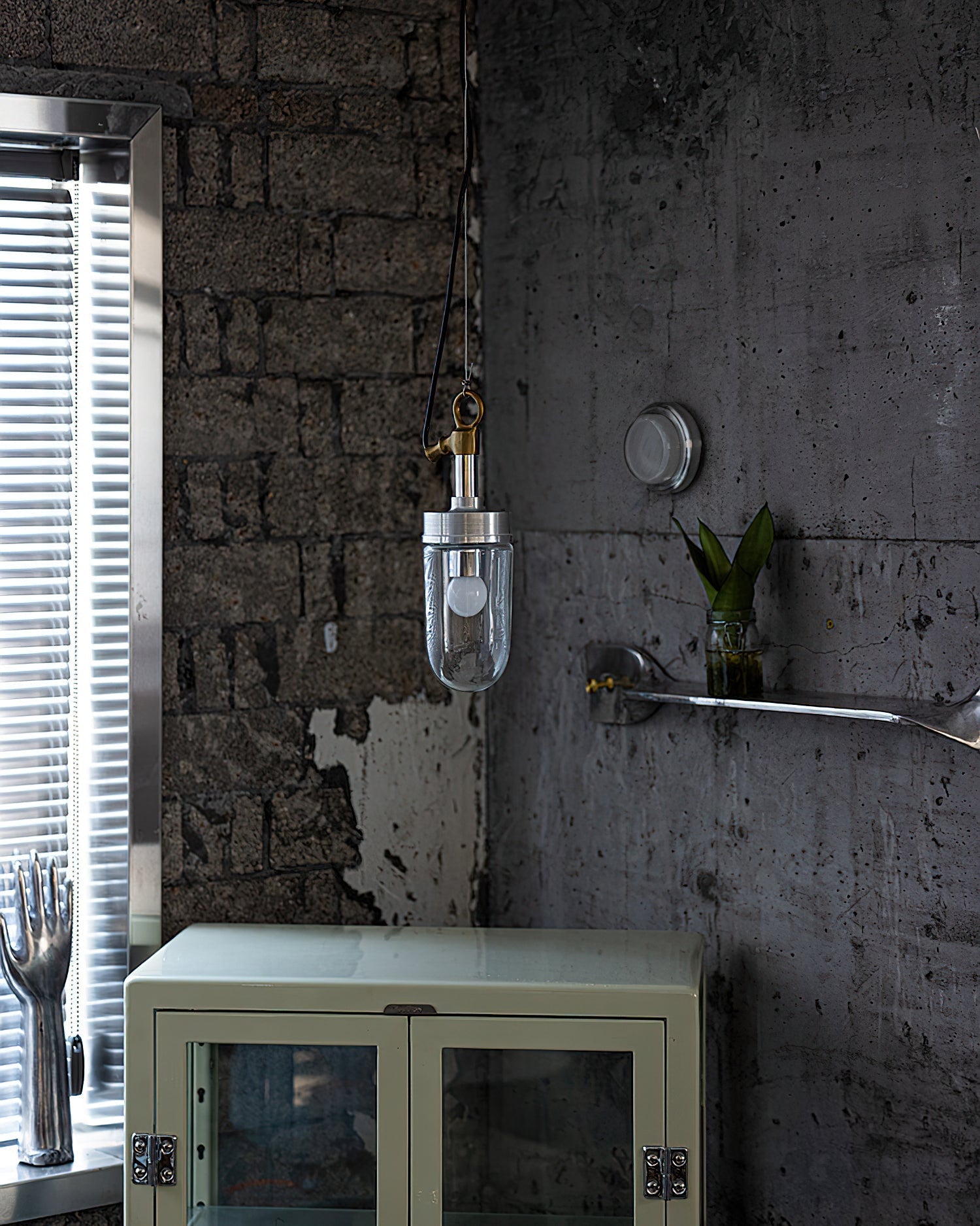 Carson Capsule Pendant Light illuminated, showcasing its warm glow.