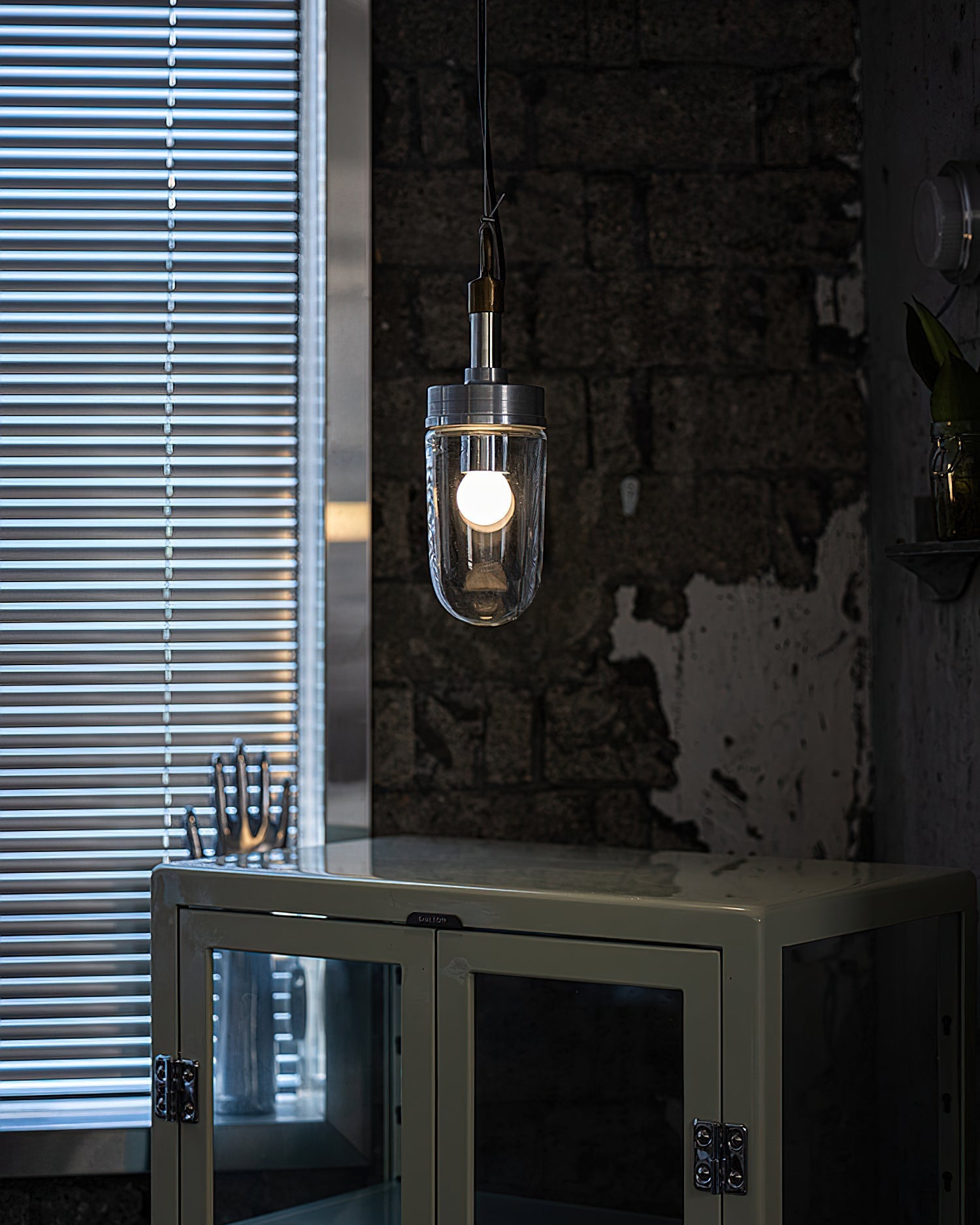 Carson Capsule Pendant Light used as vanity lighting in a bathroom setting.