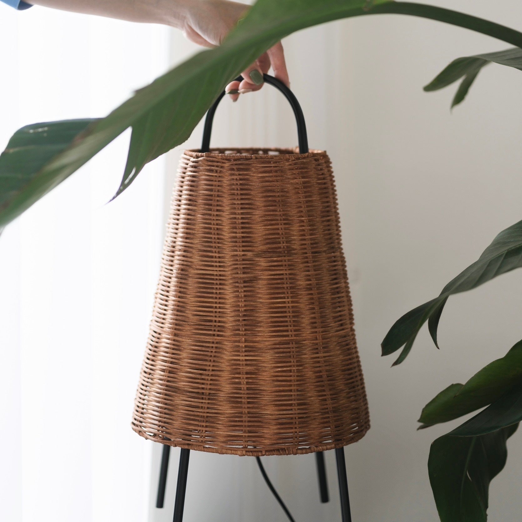 Close-up of the woven rattan texture on the Catalina table lamp.