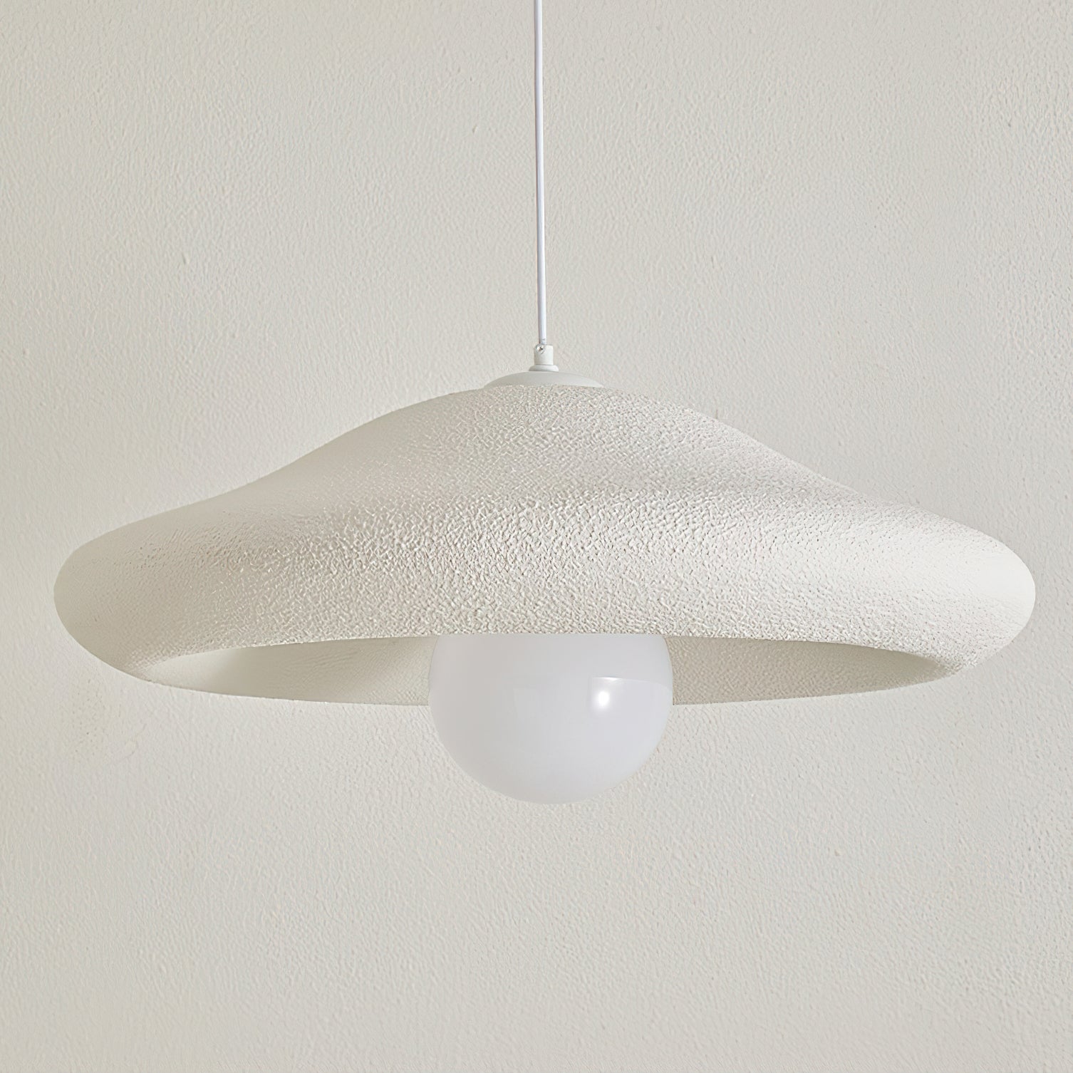 Detail of the ceiling canopy and white cord for the Chalk Pendant Light.