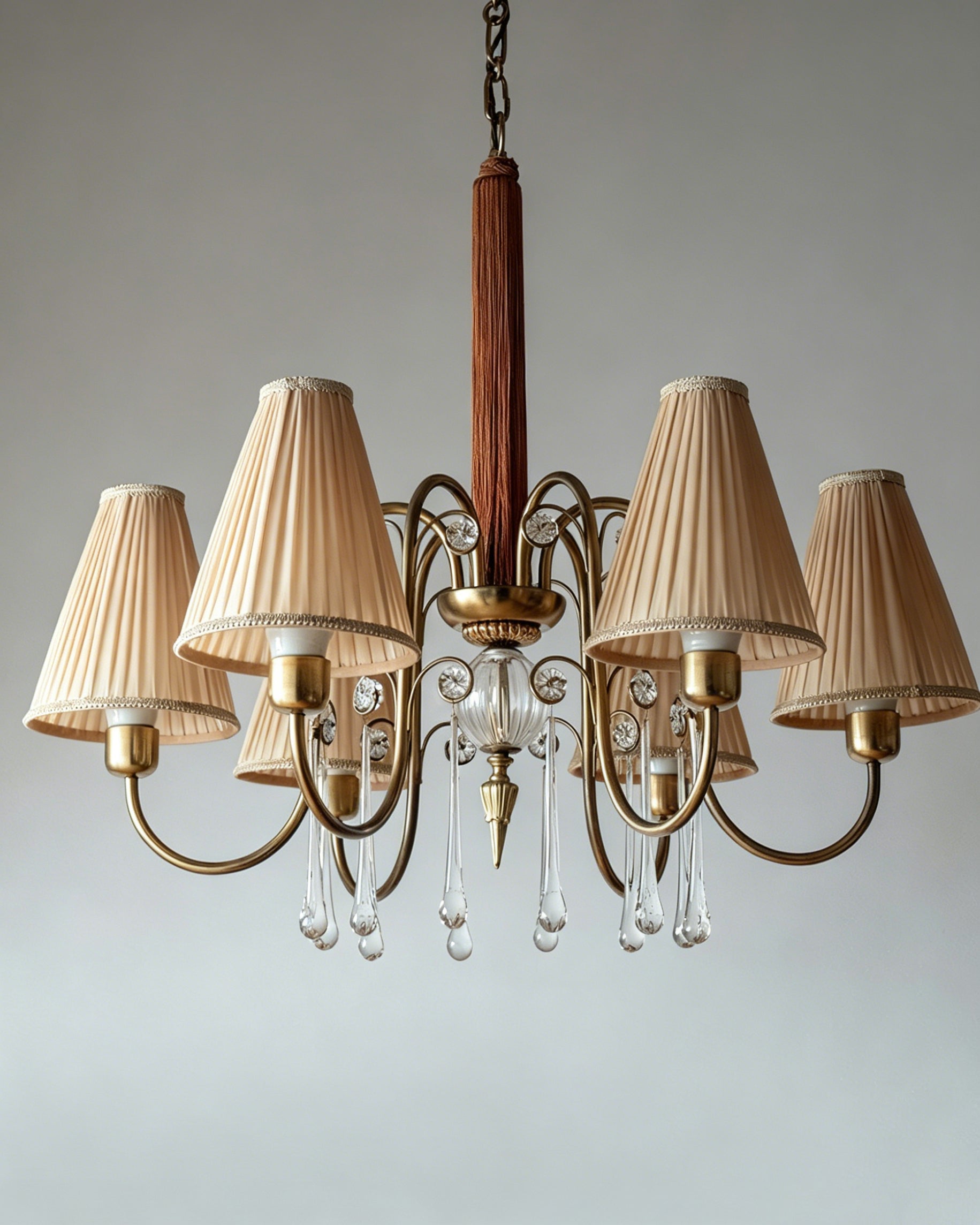Lifestyle image of the chandelier in a luxurious master bedroom setting.