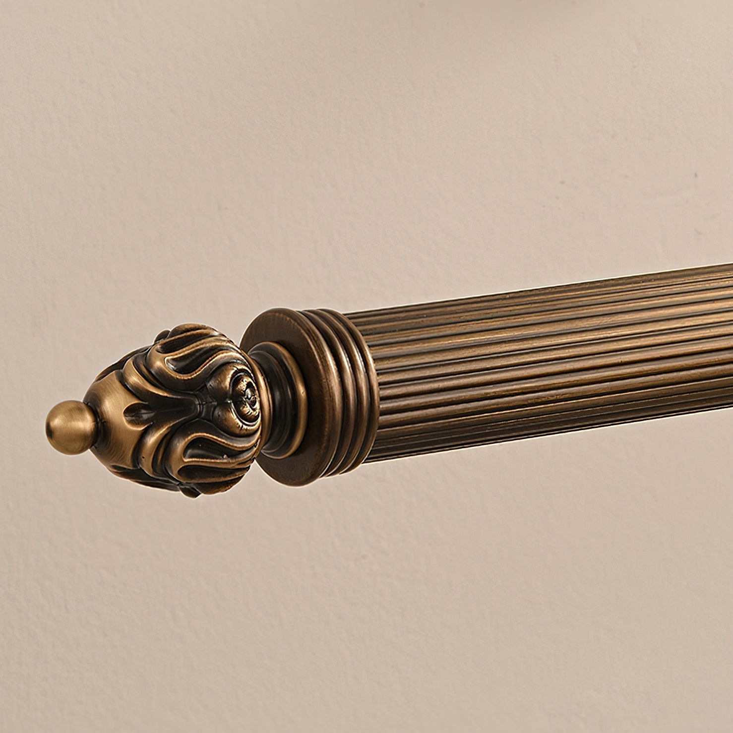 Lifestyle image of the sconce above a piece of furniture.