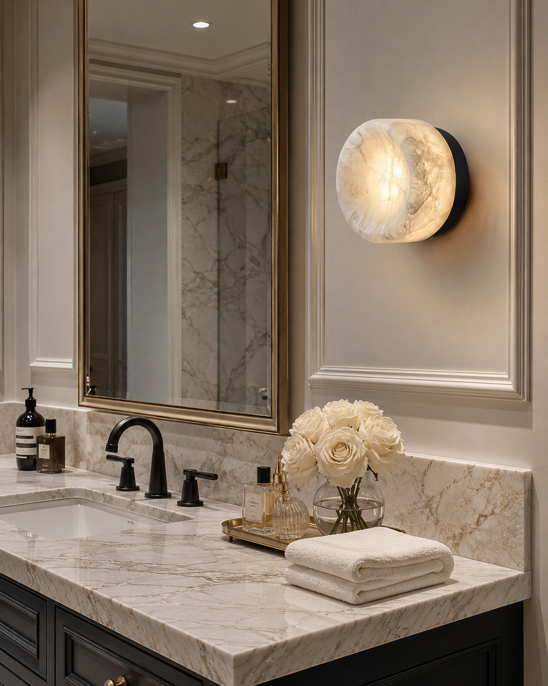 Angled view of the black finish wall sconce.