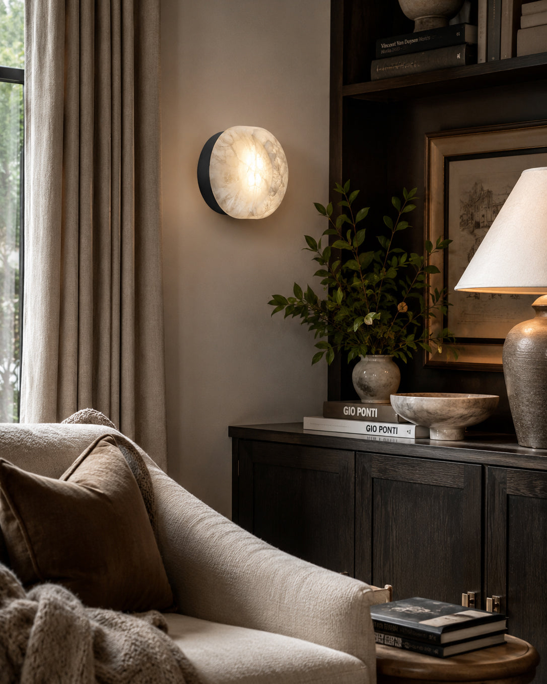 Angled view of the white finish wall sconce.