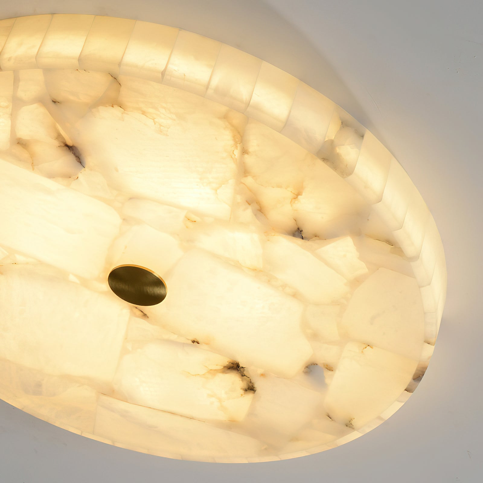 The warm, diffused light from the integrated LED through the alabaster.