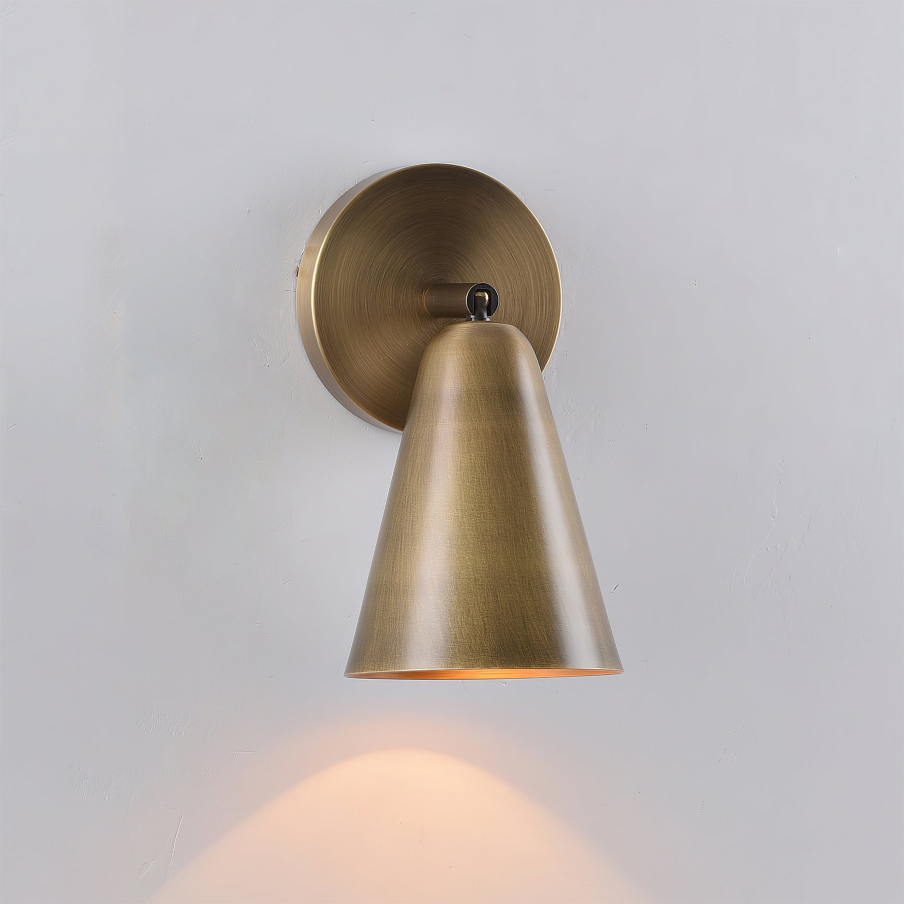 Donna Swivel Sconce in a minimalist living room setting.