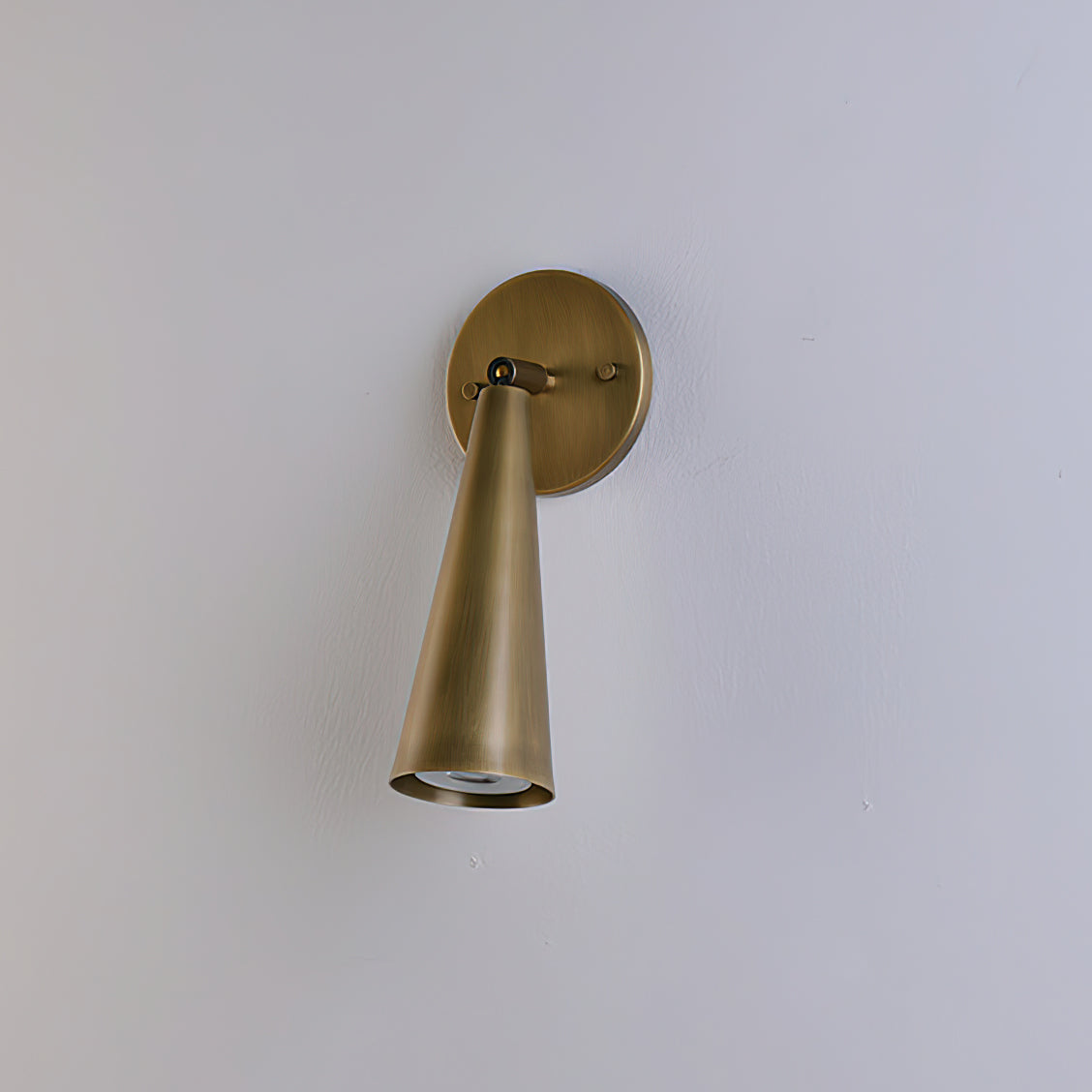 Detailed view of the swivel joint on the Donna Sconce.
