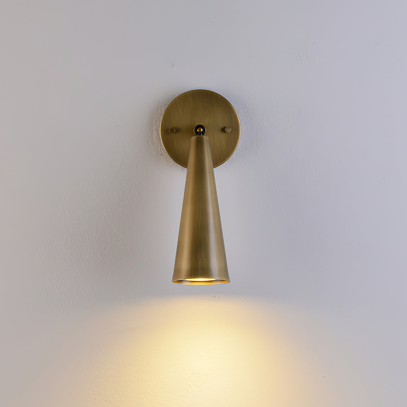 Full view of the antique brass Donna Swivel Sconce.