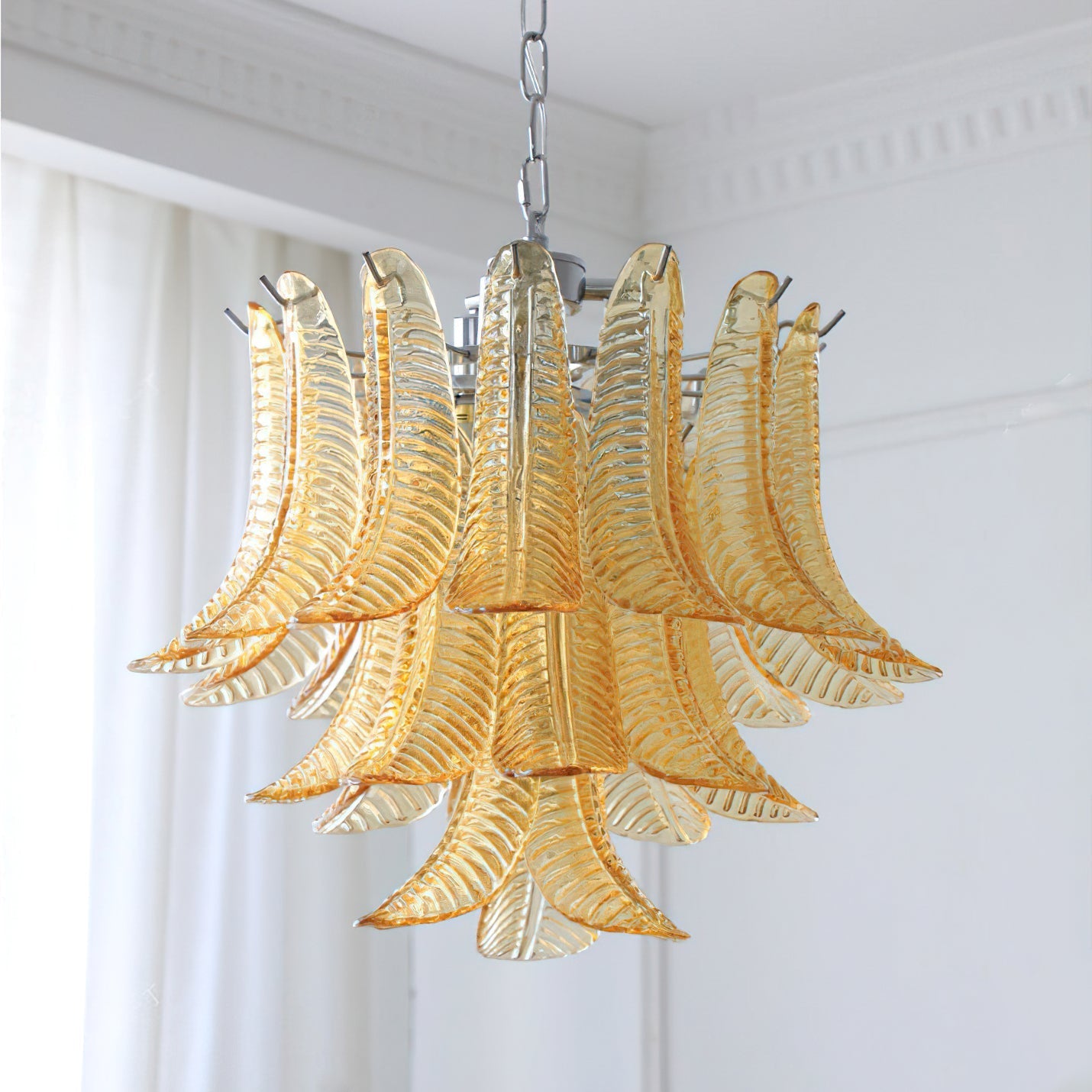 The chandelier turned off, highlighting the glass texture.