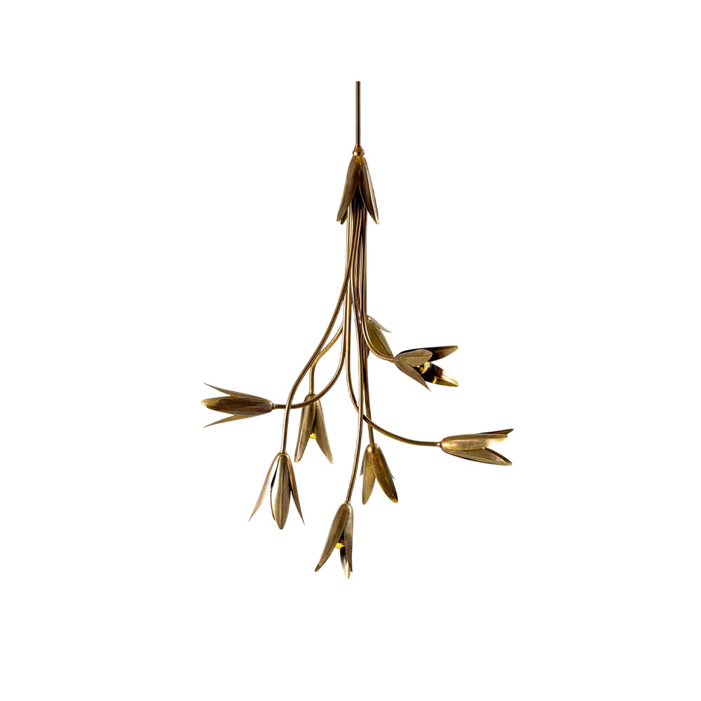 Evadne Brass Tulip Chandelier hanging in a modern dining room.