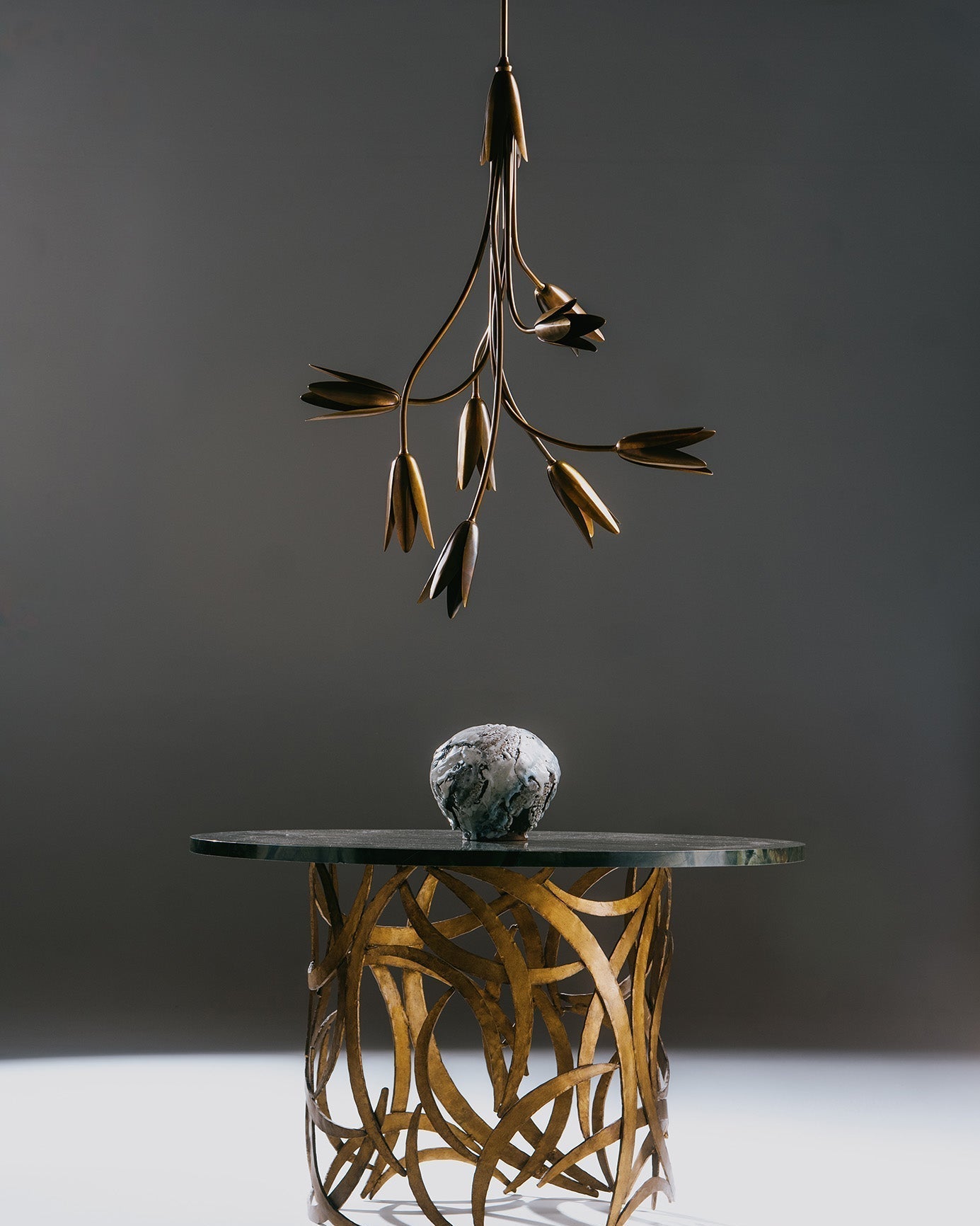 Side profile of the Evadne Brass Tulip Chandelier showing its cascading form.