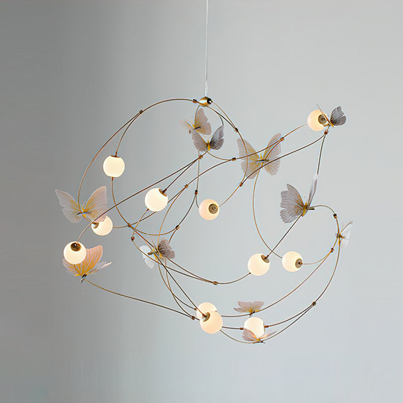 The Faye Orbit Butterfly Chandelier as a statement piece in a master bedroom.