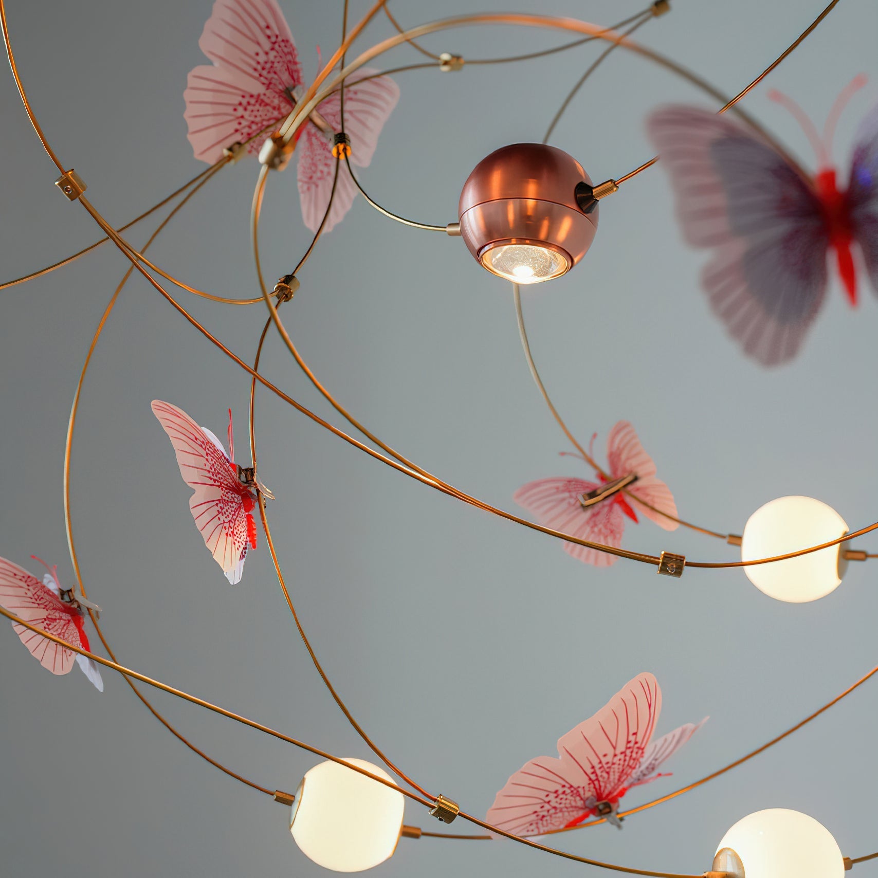 The chandelier featuring blue acrylic butterflies, unlit.