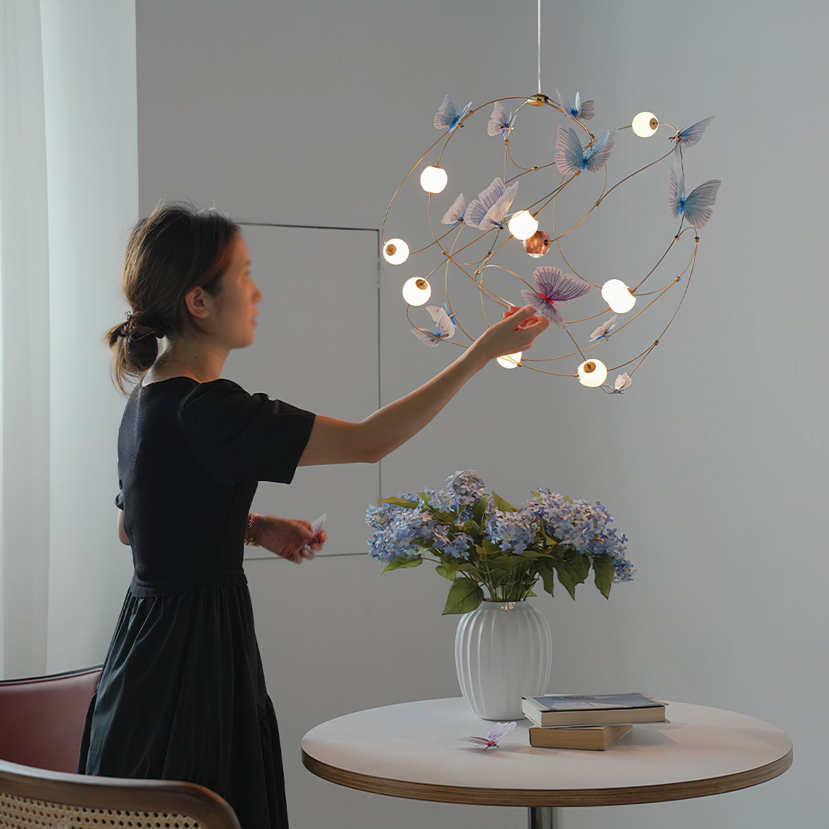 Close-up of the translucent acrylic butterflies on the Faye Orbit Chandelier.