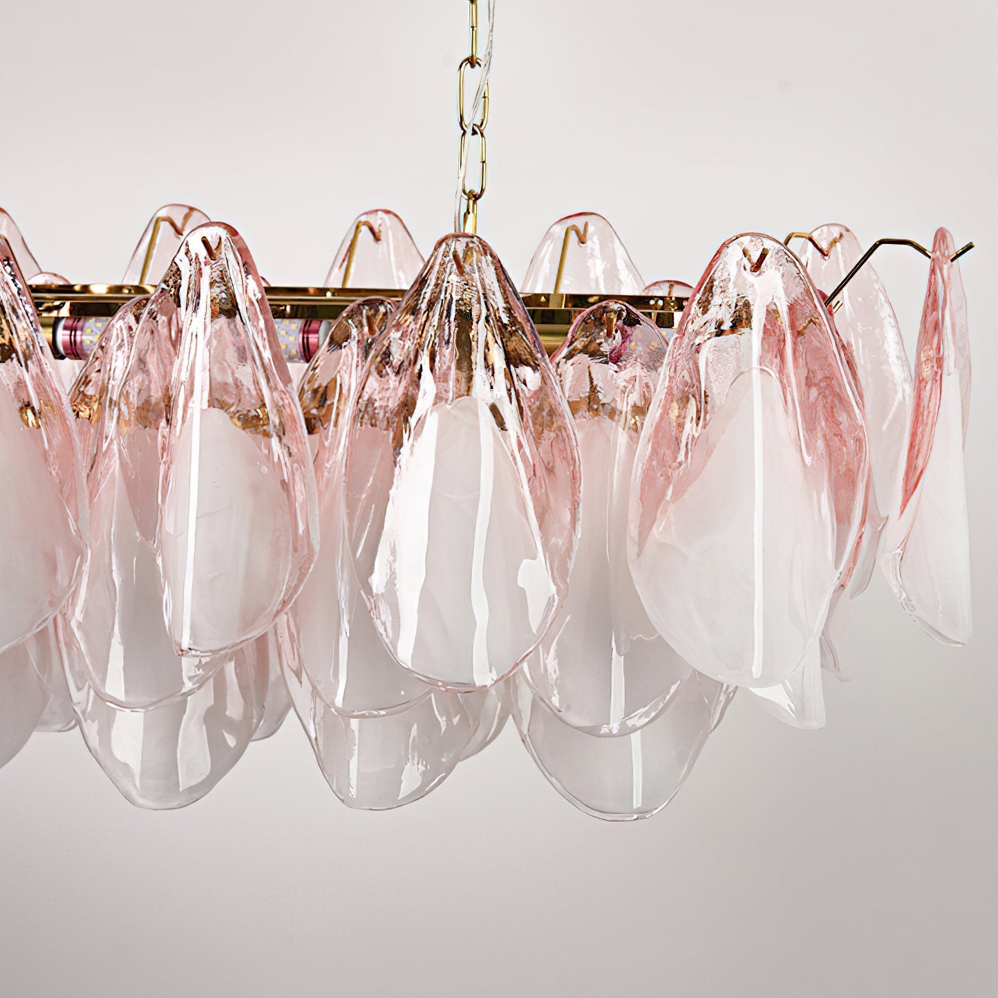 Detail shot of the E14 bulb socket nestled within the glass leaf structure.
